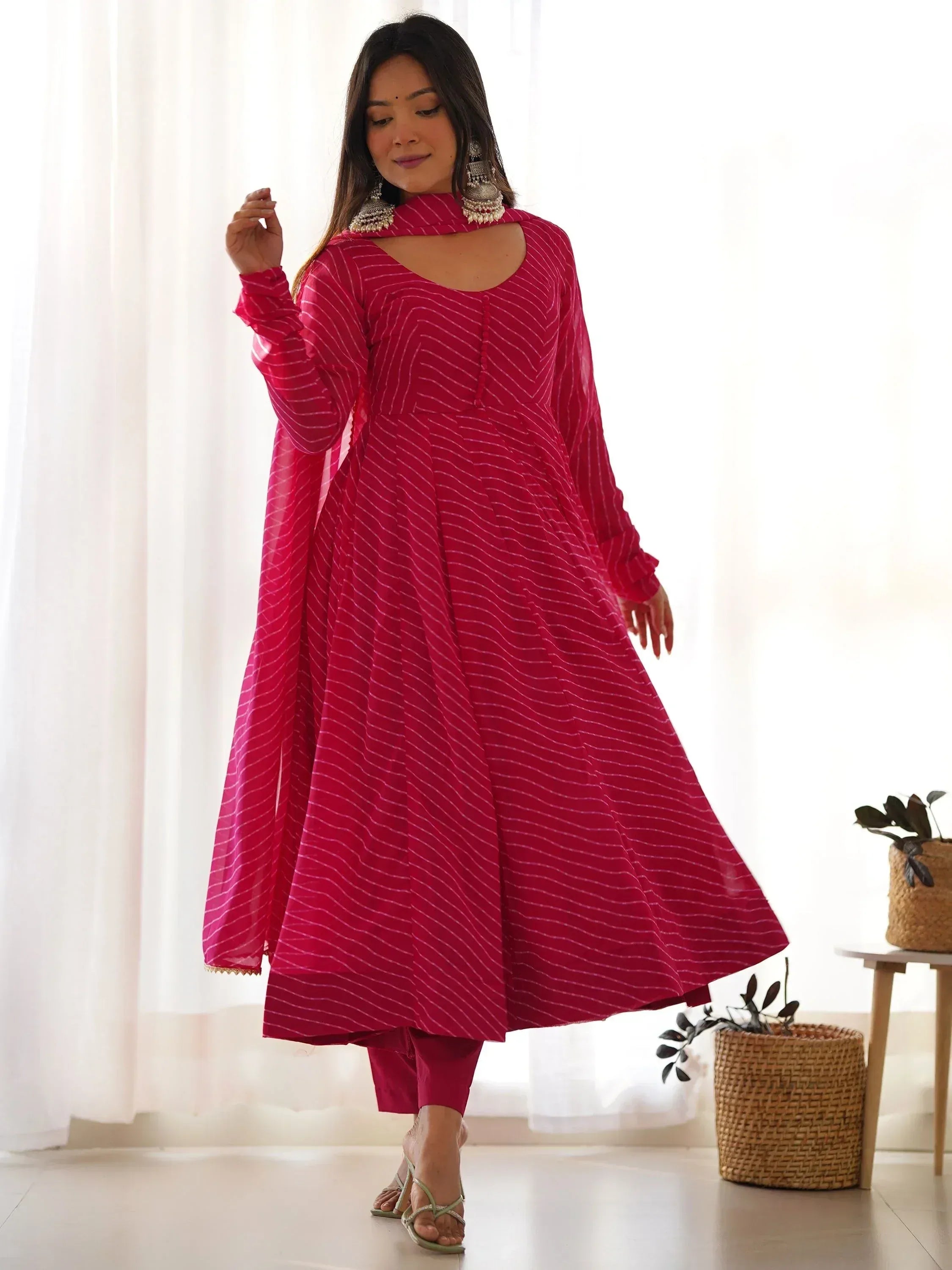 Pink striped ethnic anarkali gown with matching pants, perfect for Indian festive wear