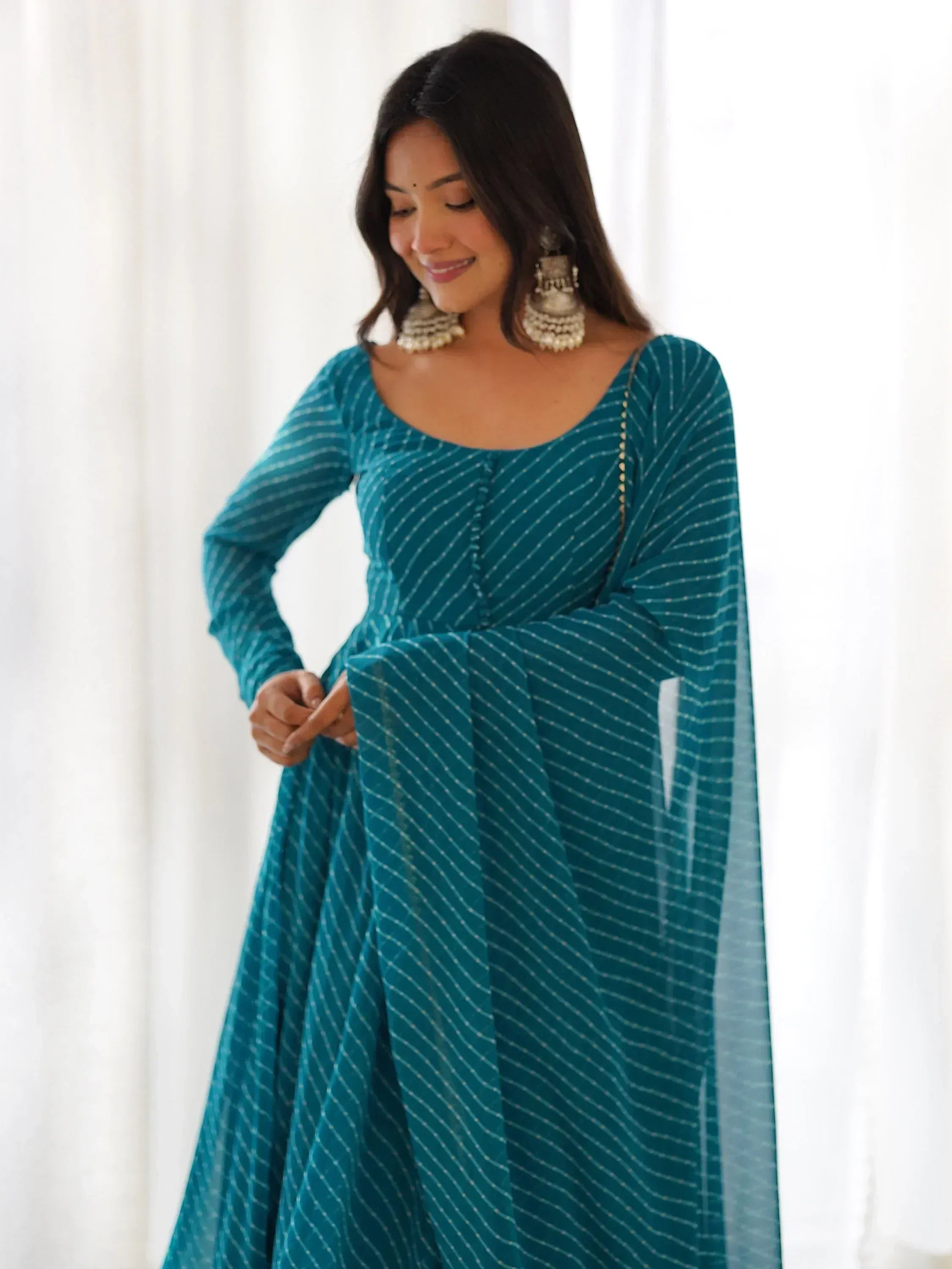 Teal striped ethnic gown with flared sleeves, perfect for Indian occasions and festive wear.