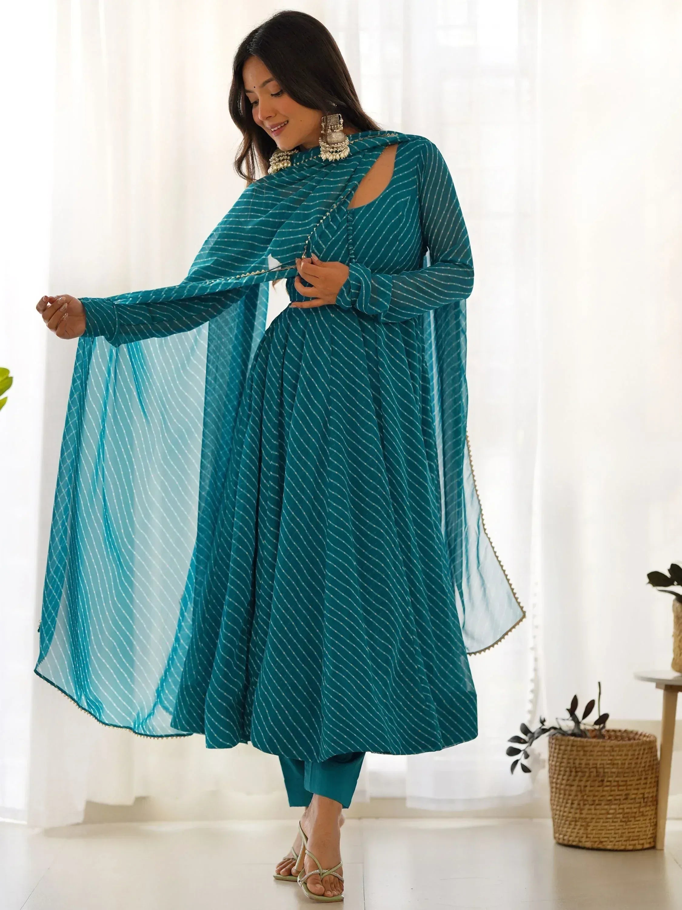 Teal striped ethnic anarkali suit with sheer dupatta, perfect for Indian occasions and festive wear