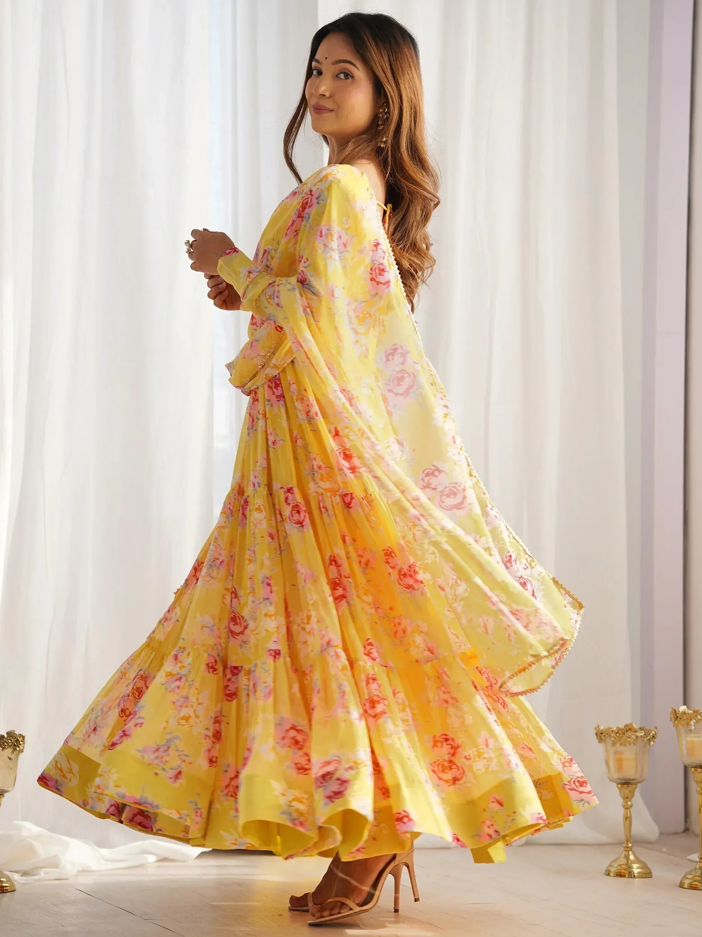 Yellow floral print ethnic gown with tiered skirt, perfect for Indian occasions and festive wear