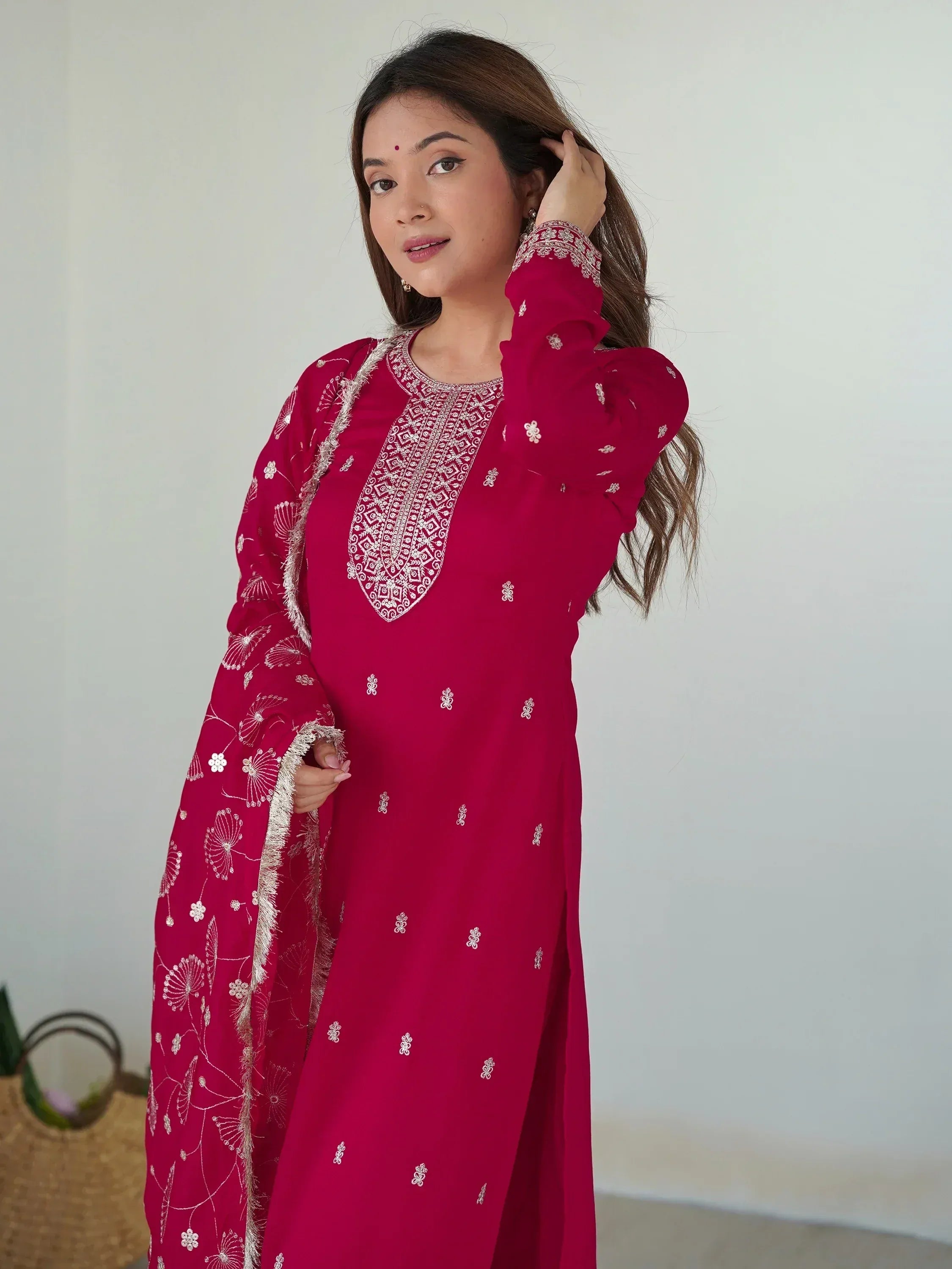 Woman in red ethnic kurti with white embroidery and matching dupatta, stylish Indian wear