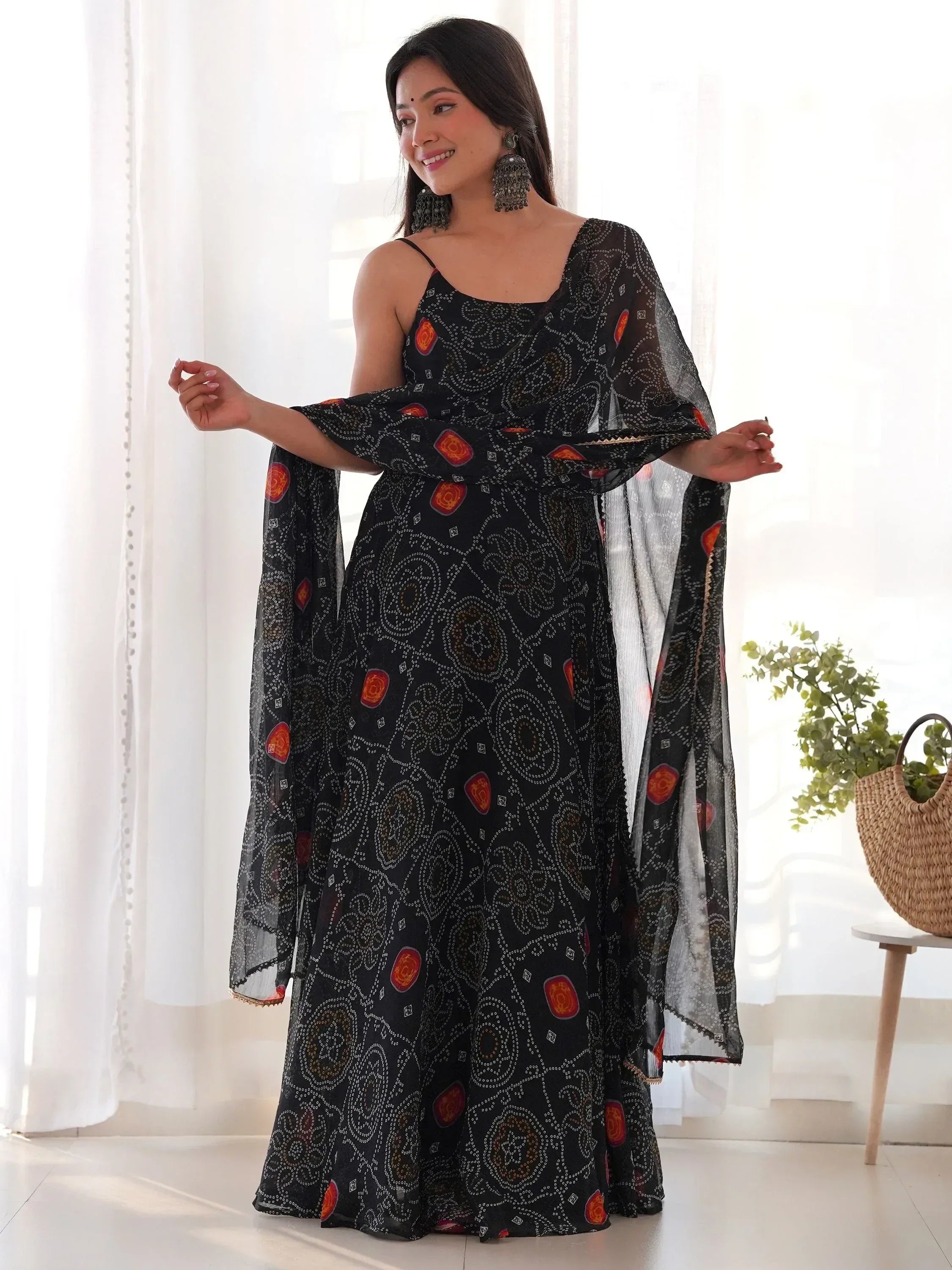 Black printed ethnic gown with sheer cape, perfect for Indian occasions and festive wear.