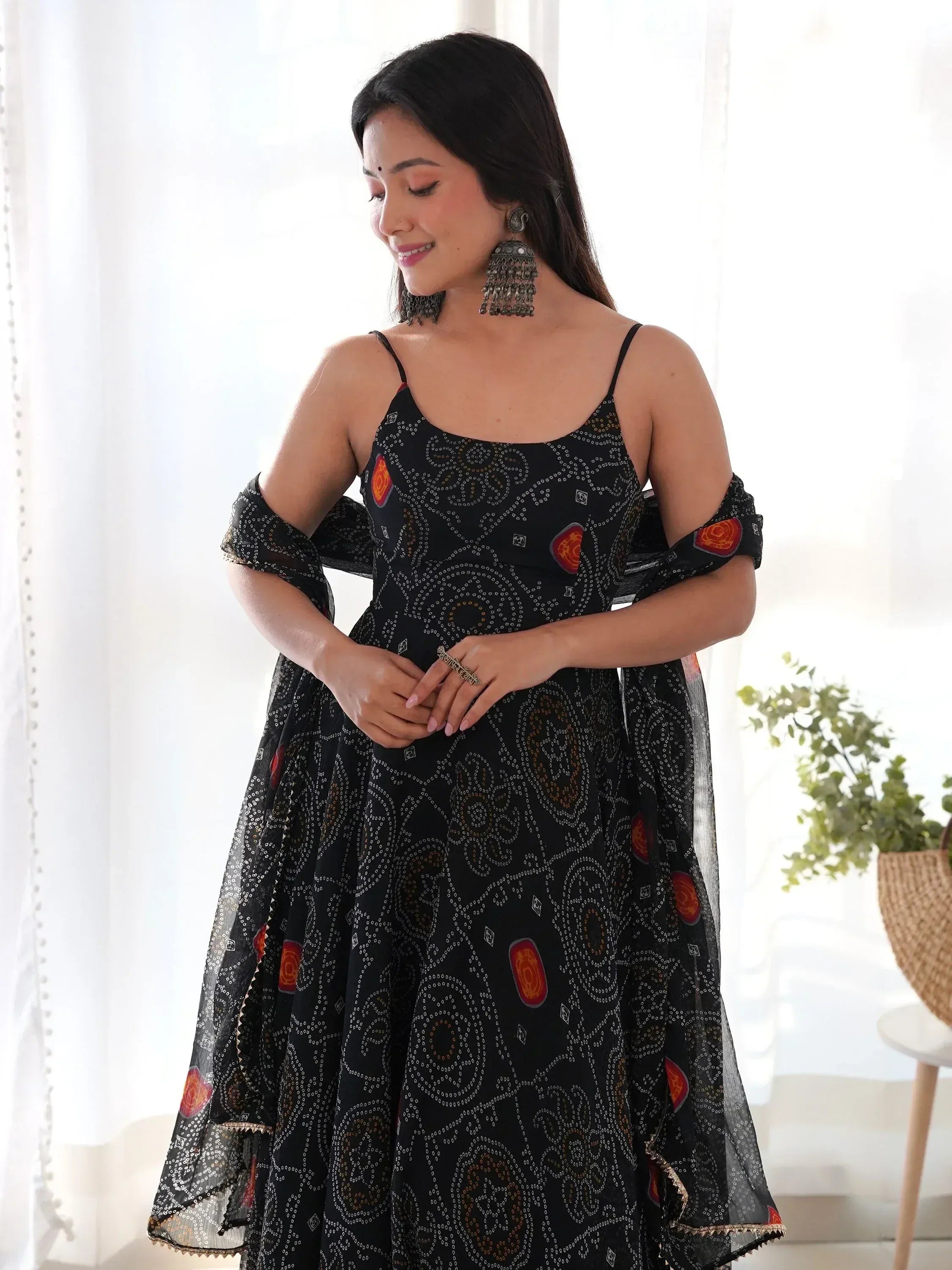 Black printed ethnic gown with cold shoulder sleeves, perfect for Indian occasions and festive wear.