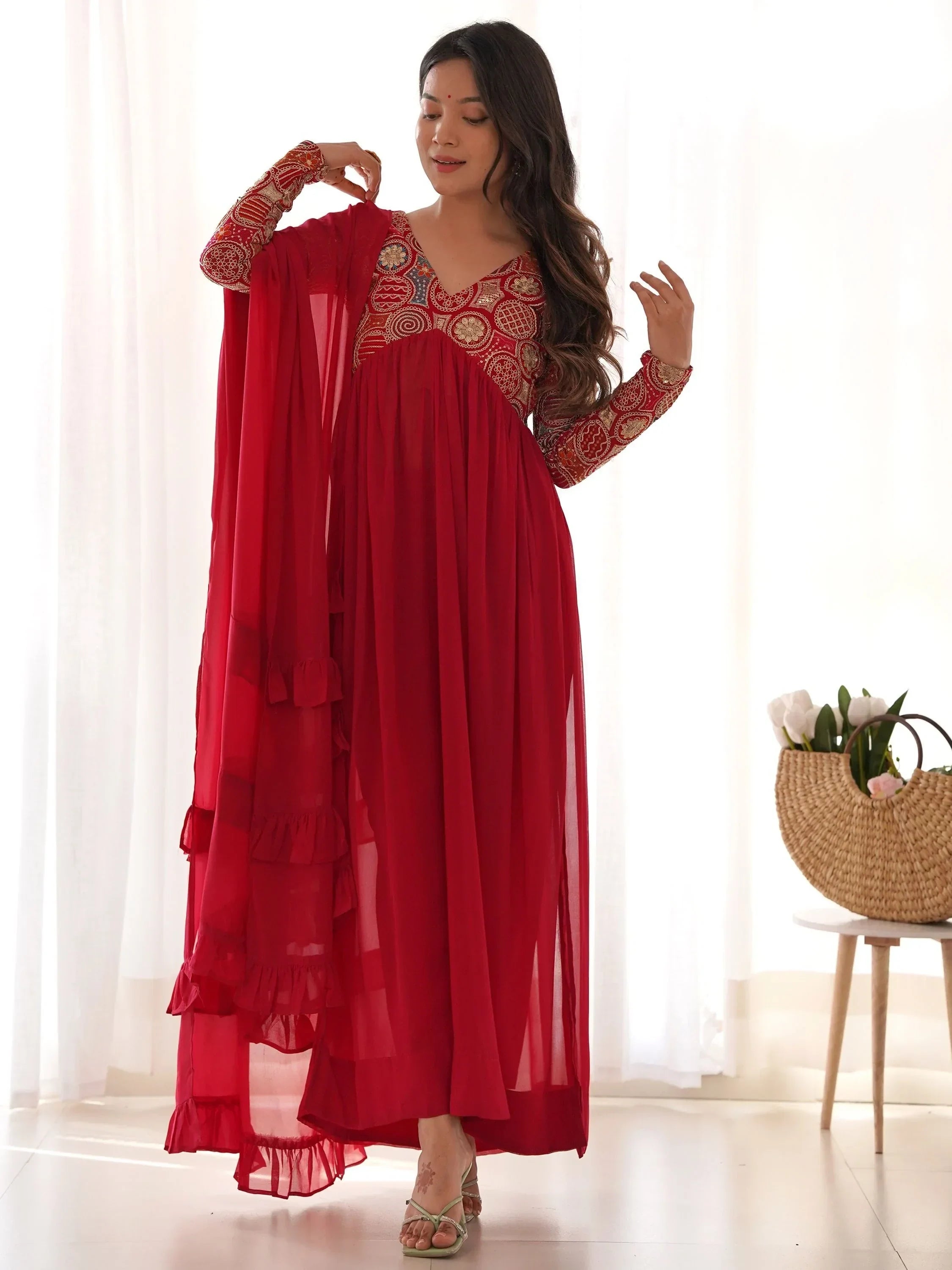 Woman in red embroidered Anarkali suit with dupatta, traditional Indian ethnic wear