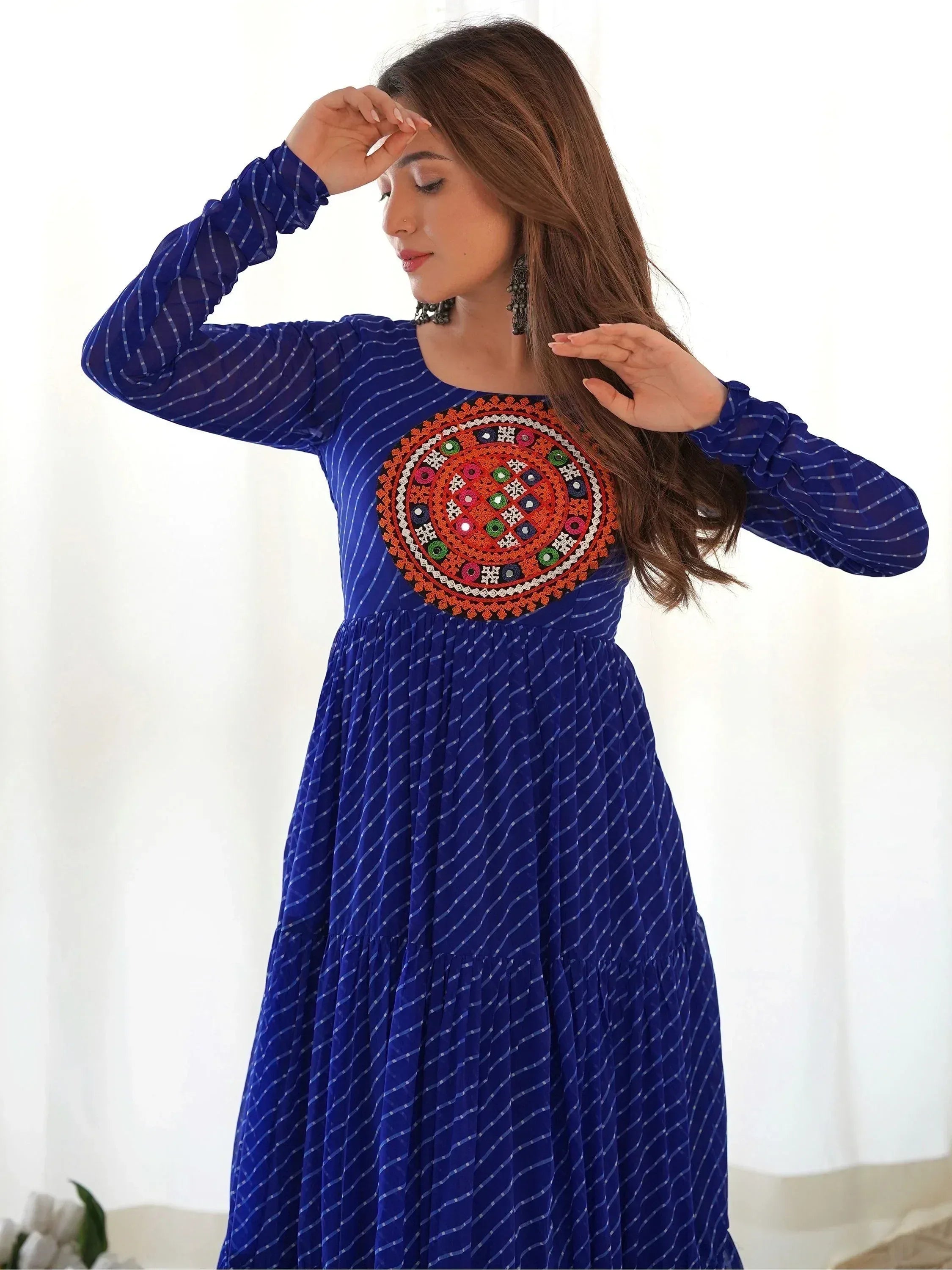 Blue ethnic gown with colorful circular embroidery, long sleeves, and striped pattern for women