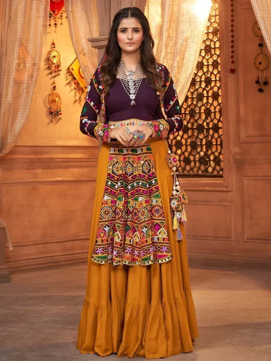 Woman in vibrant ethnic lehenga choli with mirror work, perfect for Indian festivals and weddings
