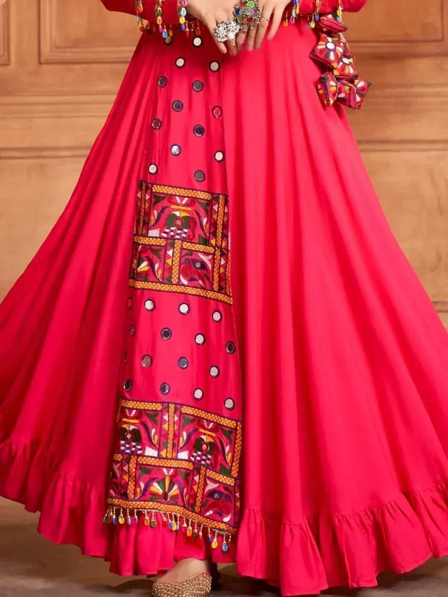 Vibrant red ethnic skirt with mirror work, embroidered panels, and ruffled hem for festive Indian wear