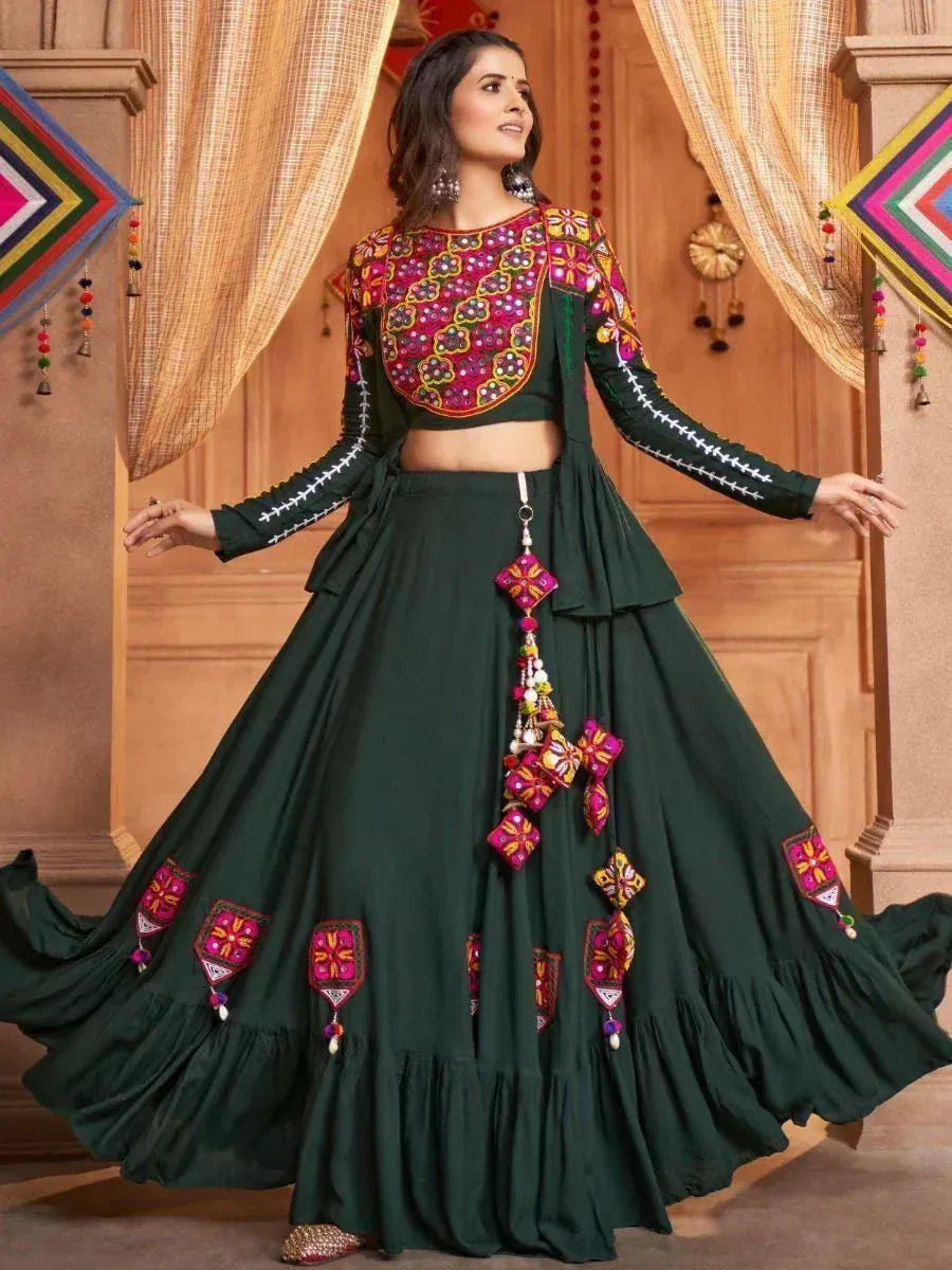 Green embroidered lehenga choli with floral motifs and tassels, perfect for festive Indian occasions
