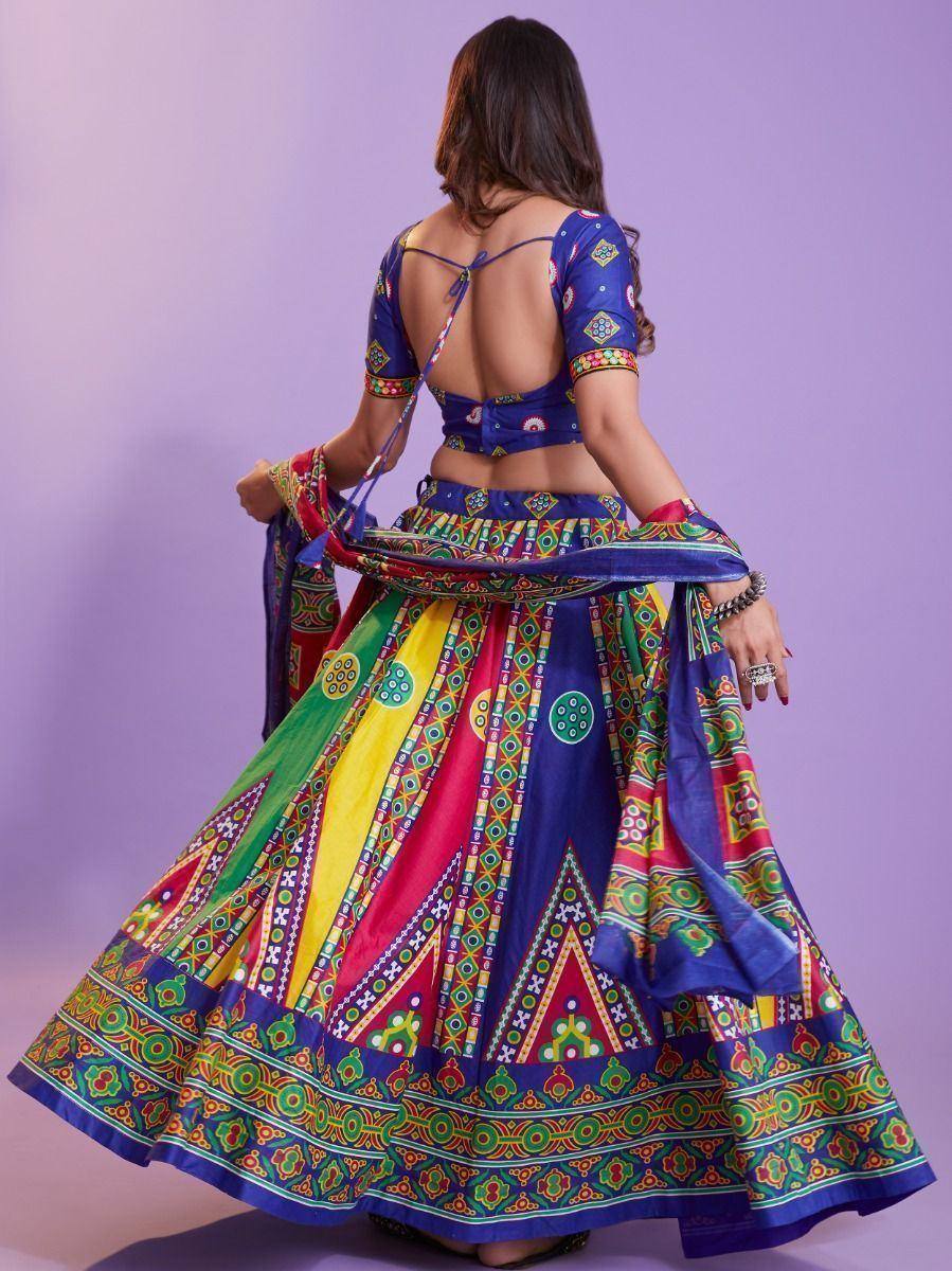 Colorful Indian lehenga choli with backless blouse and vibrant printed skirt, perfect for festive occasions