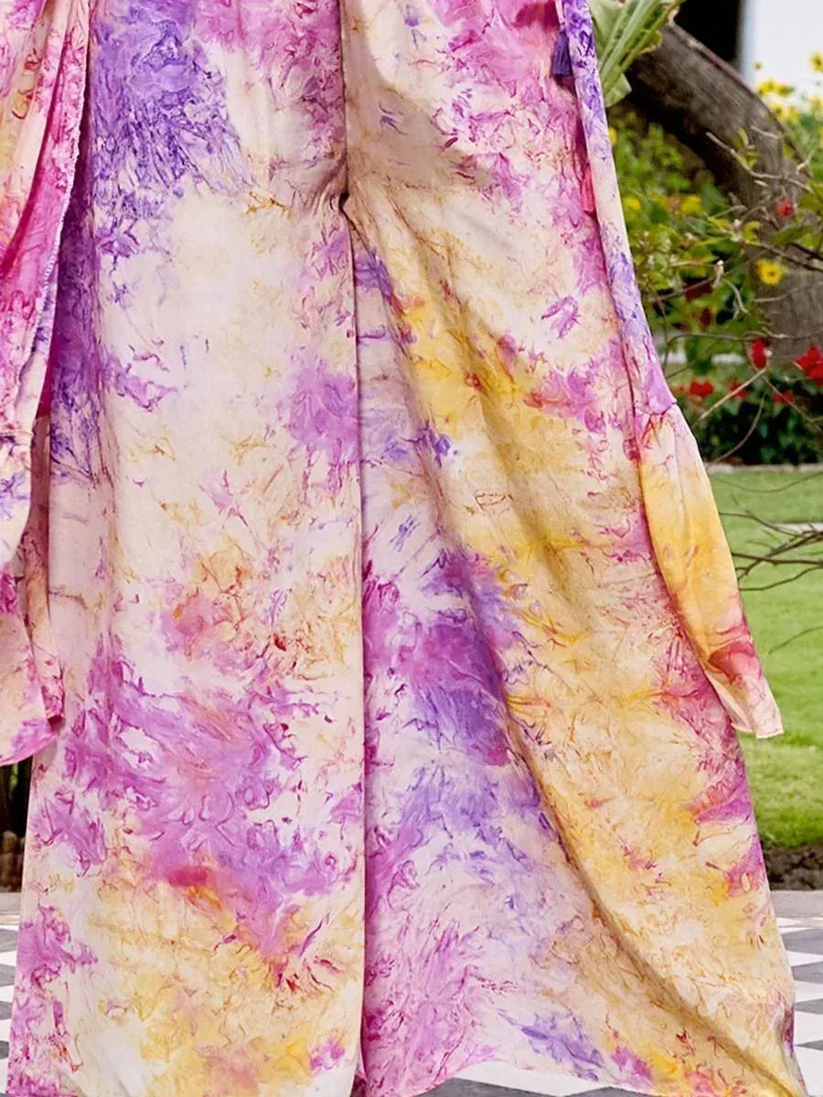 Vibrant tie-dye ethnic gown in pink, purple, yellow hues, perfect for Indian festive wear