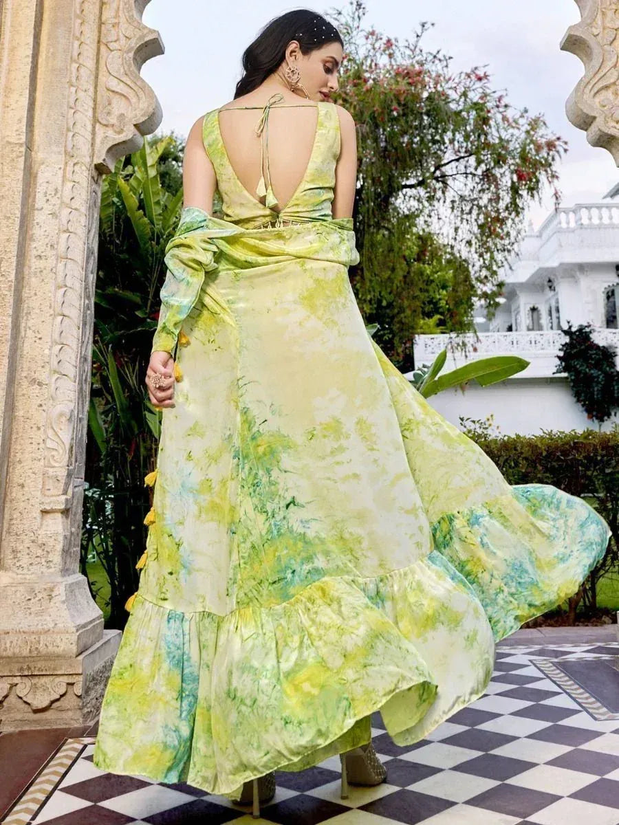 Elegant green tie-dye ethnic gown with ruffled hem and open back, perfect for Indian occasions