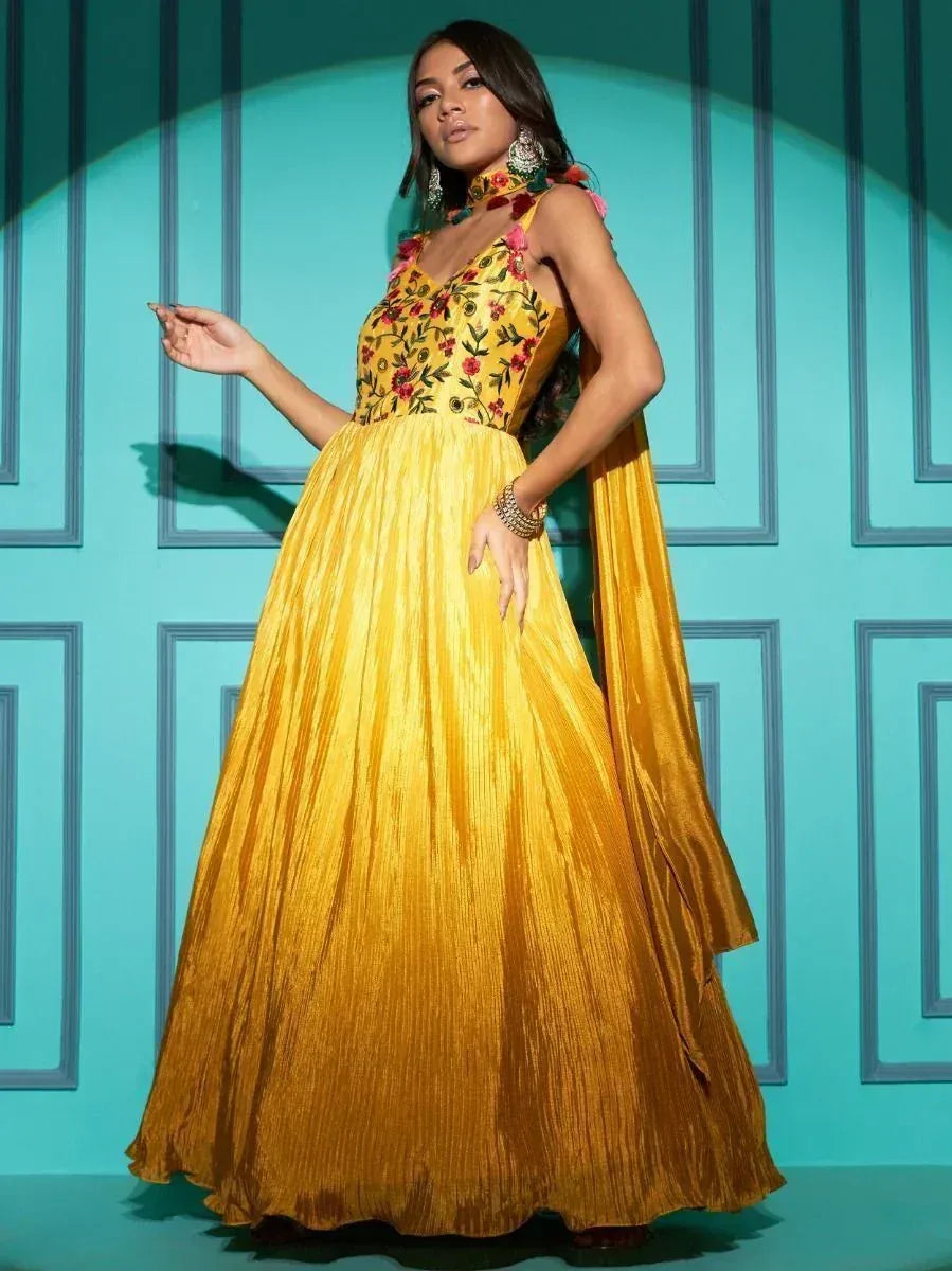 Yellow floral embroidered ethnic gown with pleated skirt, perfect for Indian festive occasions