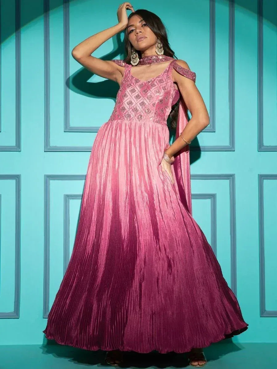 Pink embroidered ethnic gown with pleated skirt, cold shoulder design, perfect for Indian occasions