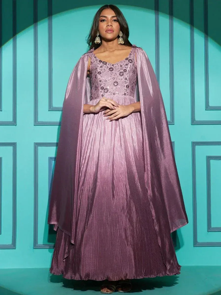 Elegant mauve ethnic gown with cape, pleated skirt, and floral embroidery for festive occasions