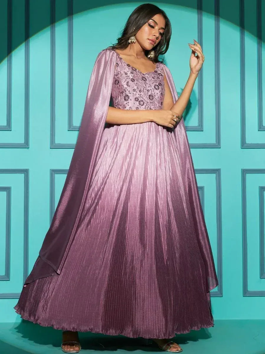 Elegant purple ethnic gown with floral embroidery and pleated skirt, perfect for Indian festive occasions