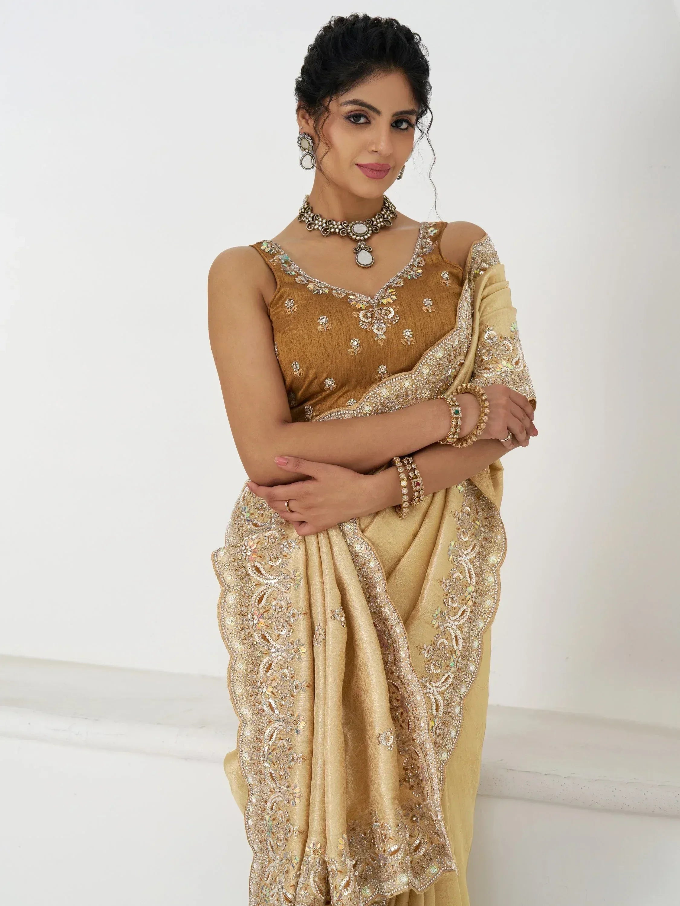 Elegant gold embroidered saree with floral detailing, perfect for Indian ethnic wear occasions.