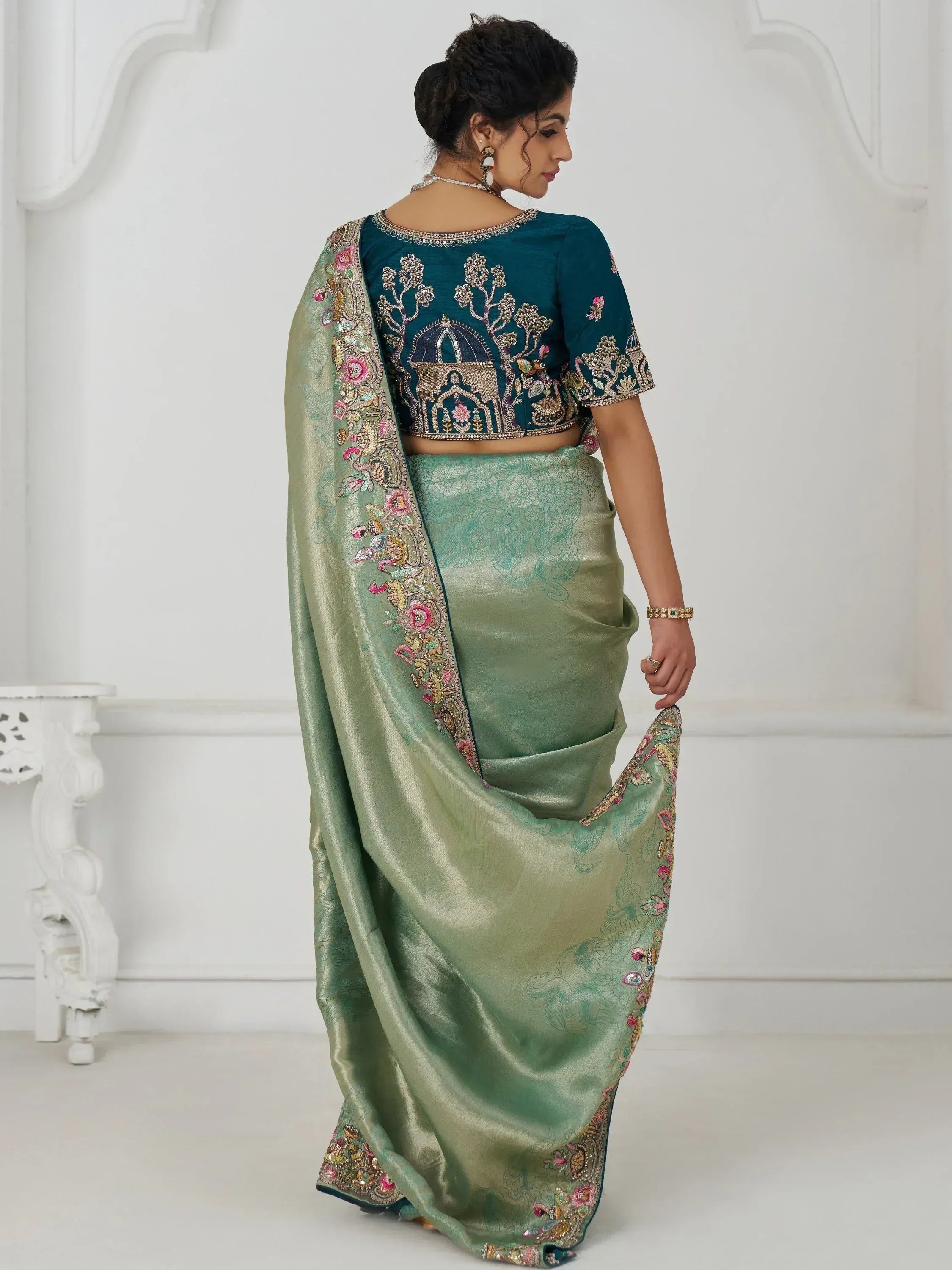 Elegant green saree with embroidered blouse, perfect for Indian ethnic wear occasions.