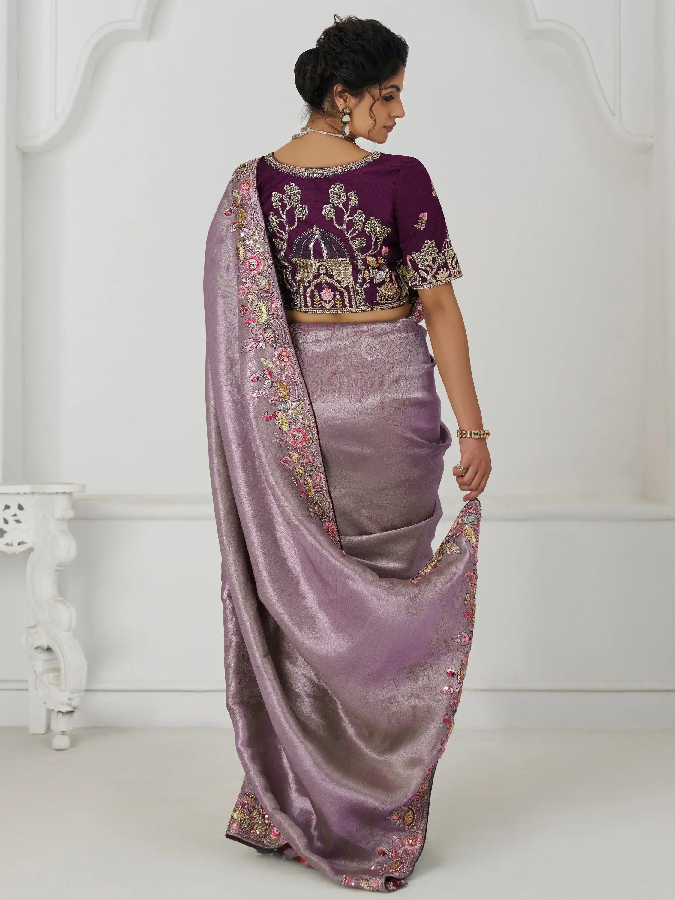 Purple embroidered saree with designer blouse, perfect for Indian ethnic wear and festive occasions.