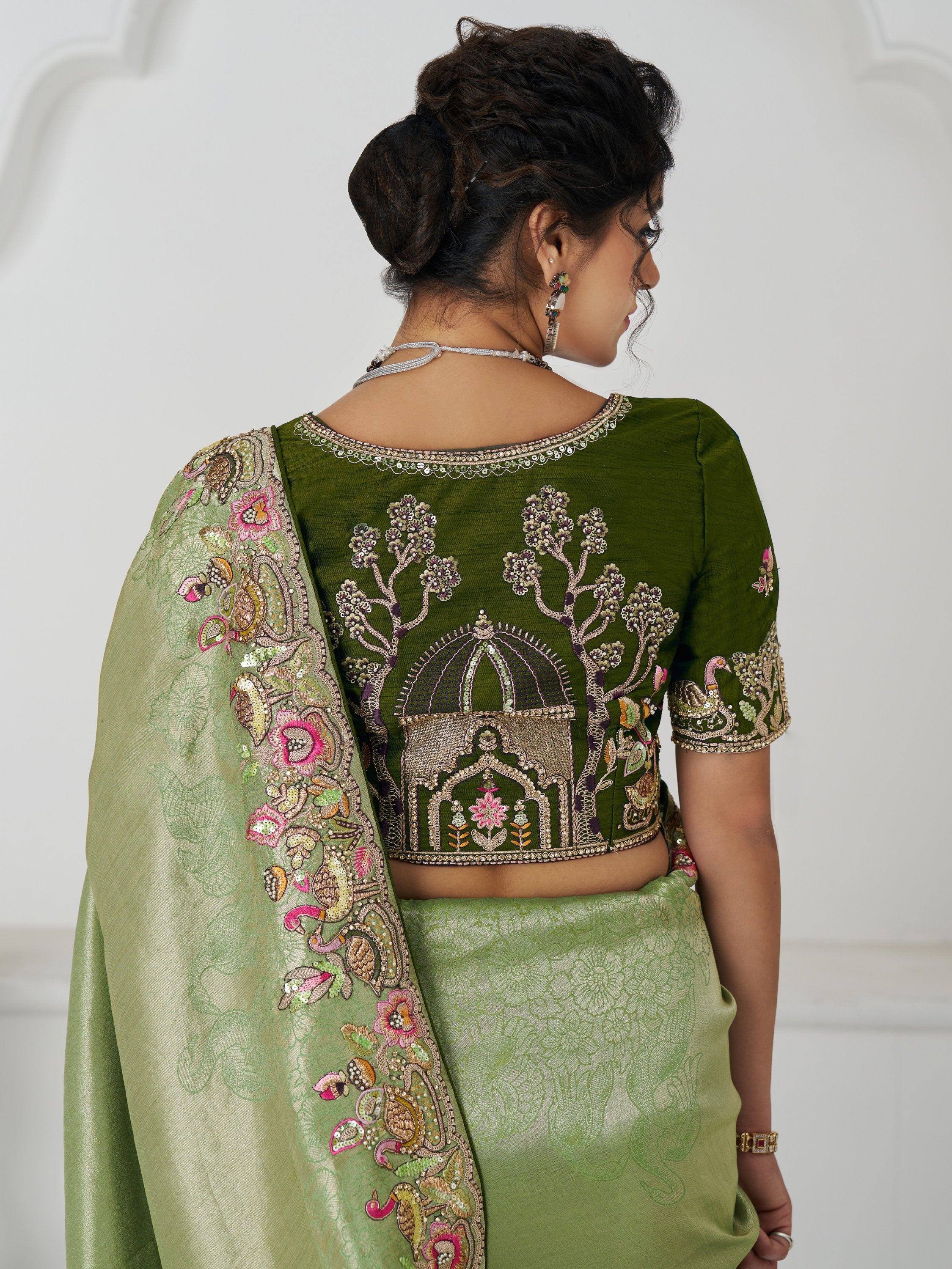 Green embroidered lehenga choli with floral and temple motifs, perfect for Indian ethnic wear occasions
