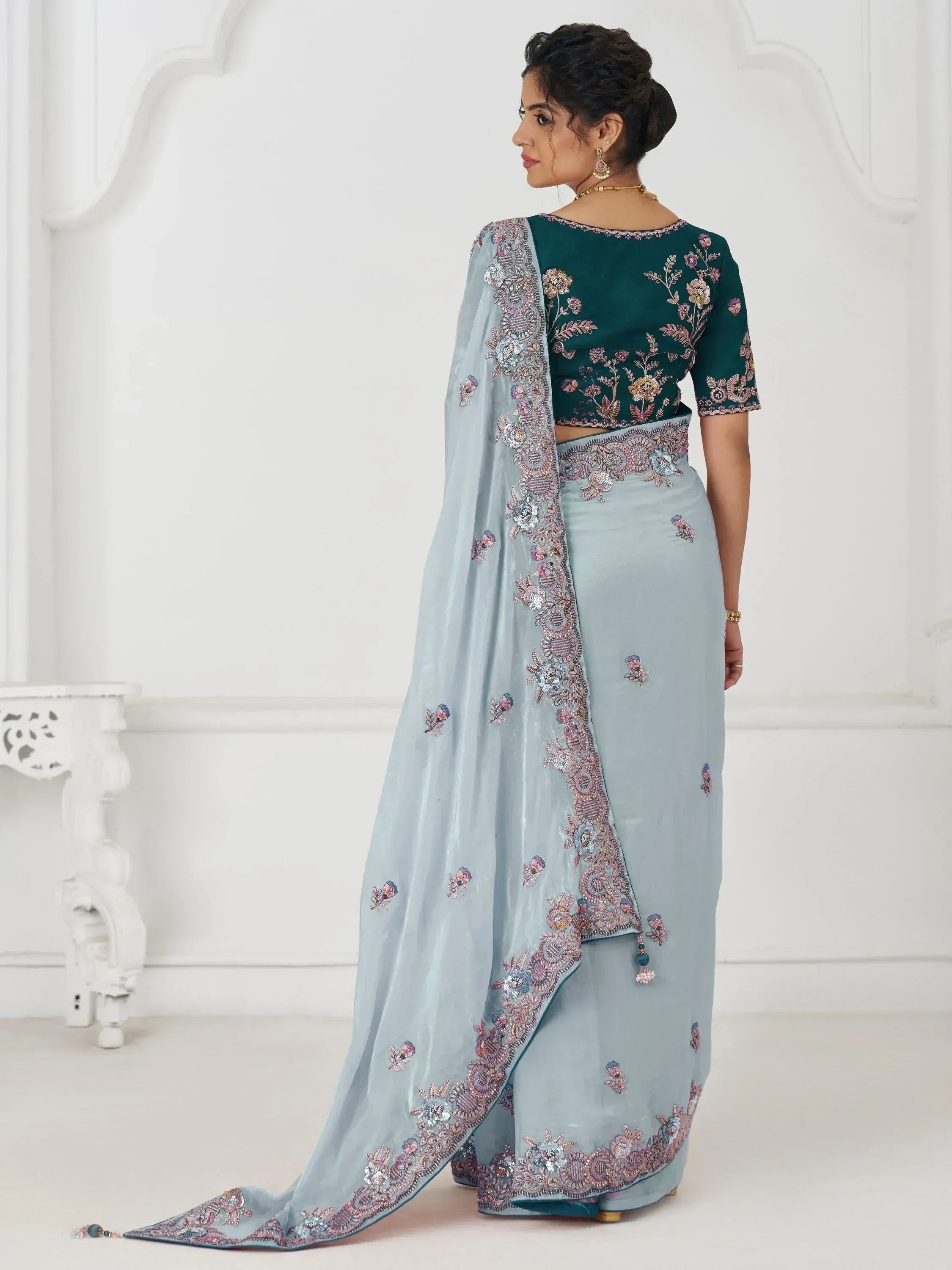 Light blue embroidered saree with green velvet blouse, floral beadwork, perfect for Indian ethnic occasions