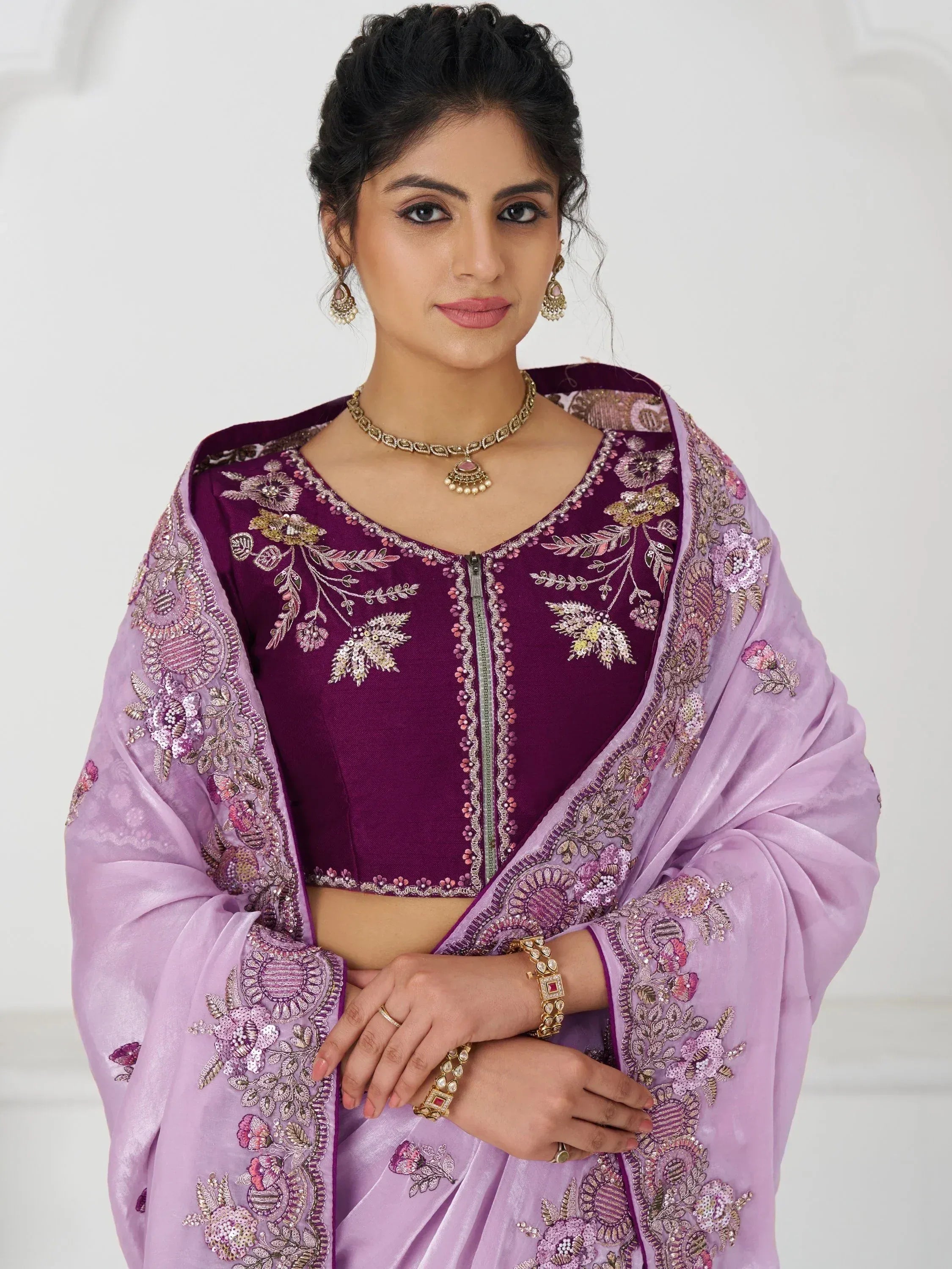 Purple embroidered Indian ethnic wear with floral dupatta, perfect for weddings and festive occasions.