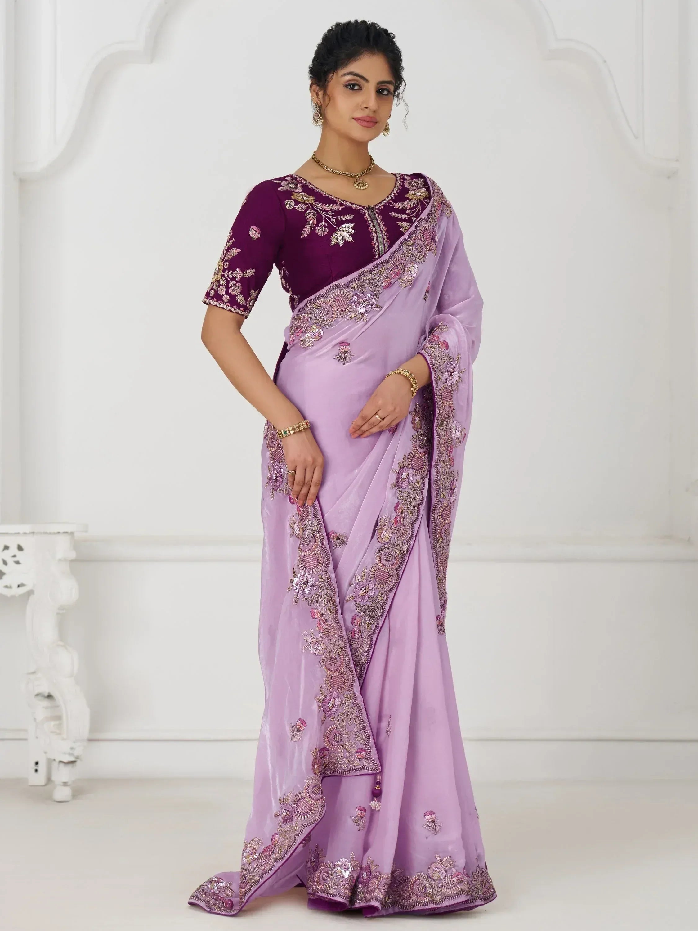 Lavender saree with purple blouse, floral embroidery, and sequin detailing for Indian ethnic wear