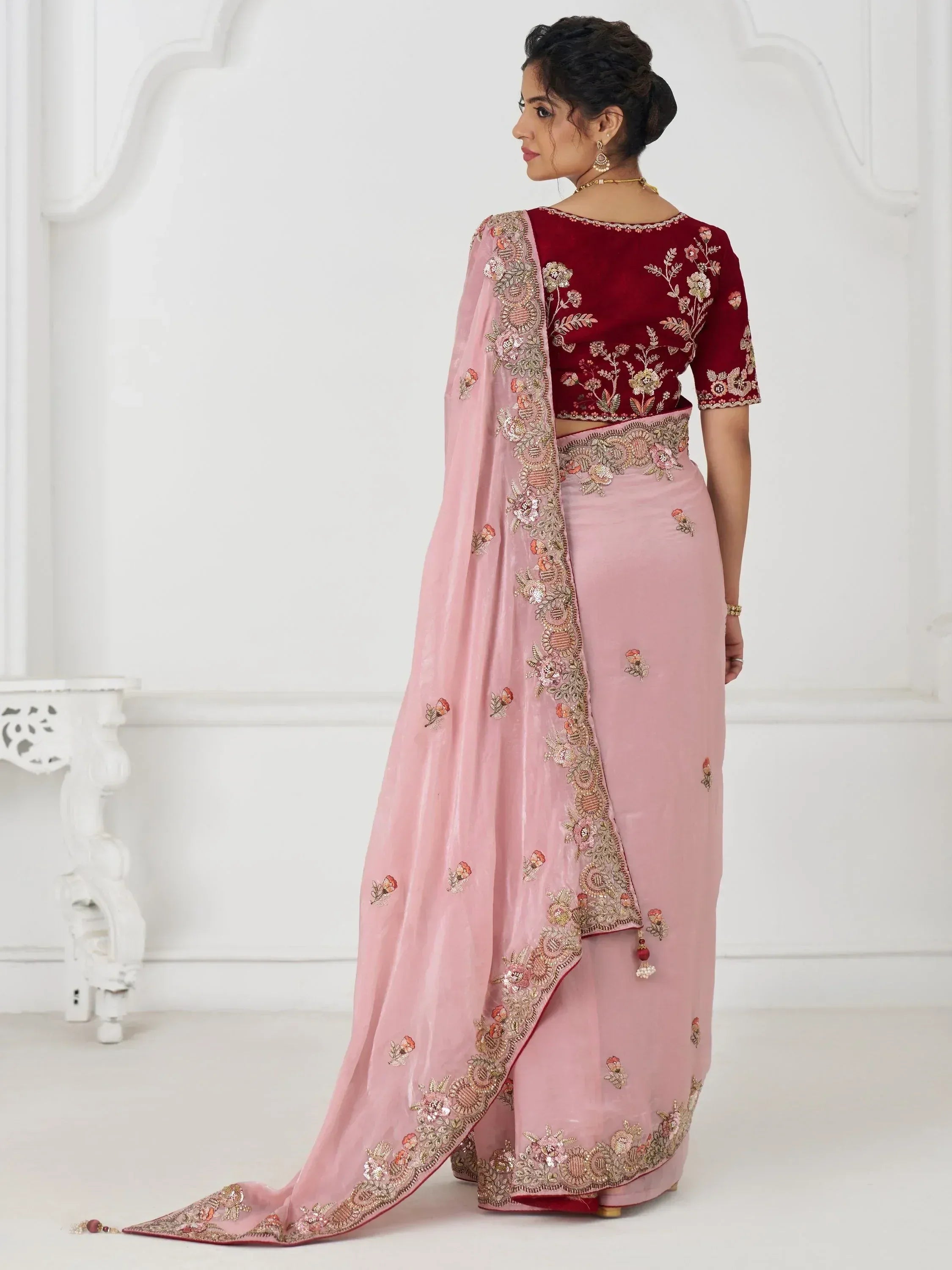 Pink and maroon embroidered lehenga choli with floral detailing, perfect for Indian ethnic wear occasions.