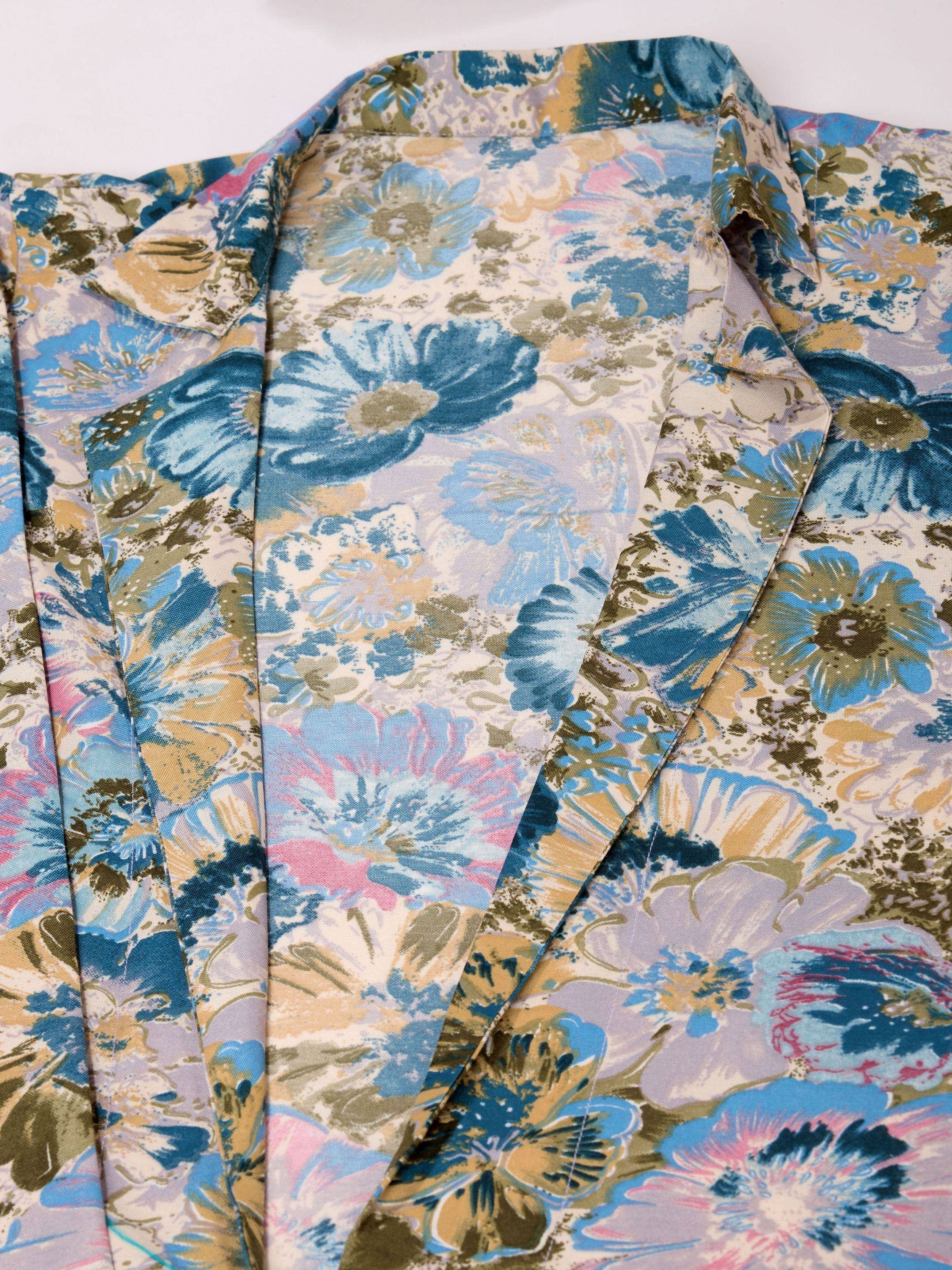 Blue and green floral print ethnic kurta with vibrant pattern and pleated front detail