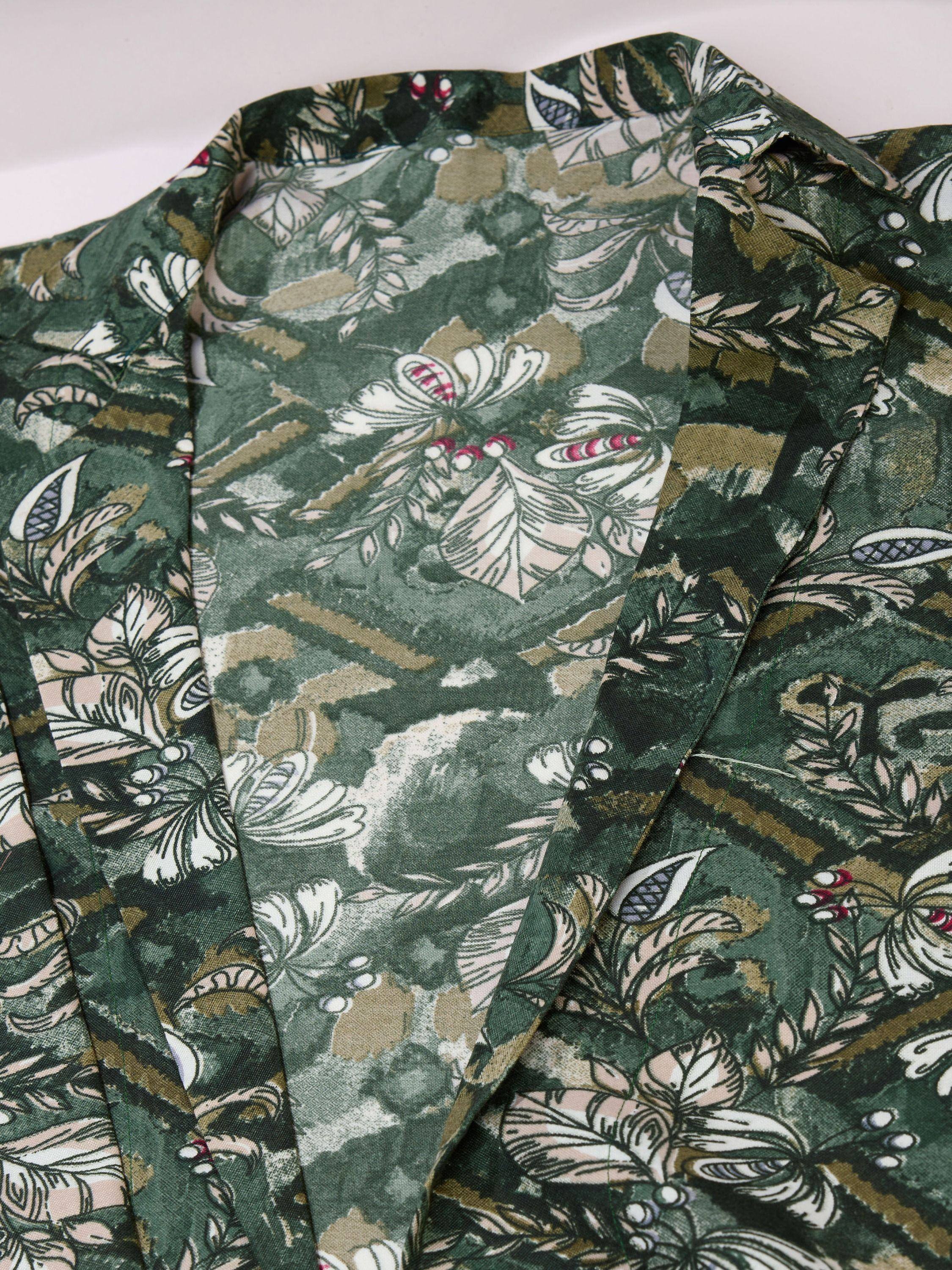 Green floral print ethnic gown with white and pink botanical design, perfect for Indian wear.