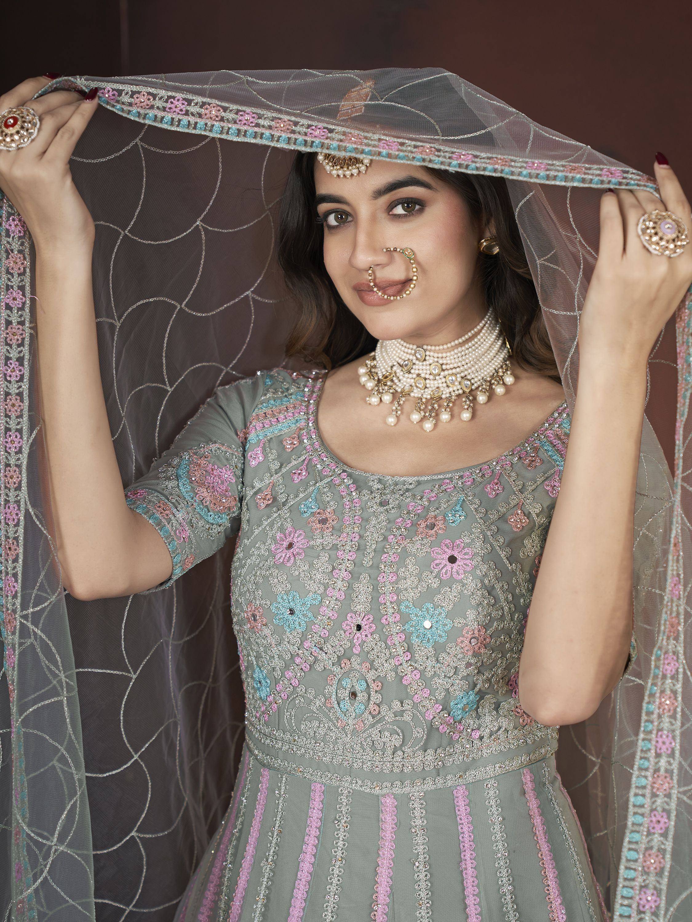 Elegant grey floral embroidered lehenga choli with matching dupatta and pearl jewelry
