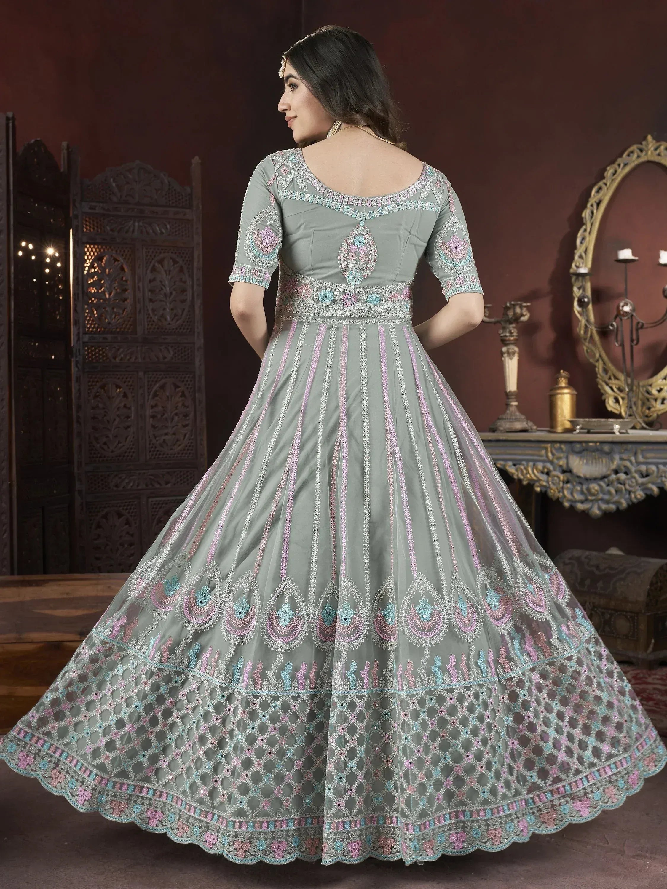Elegant grey lehenga choli with pastel embroidery and scalloped hem for Indian ethnic wear