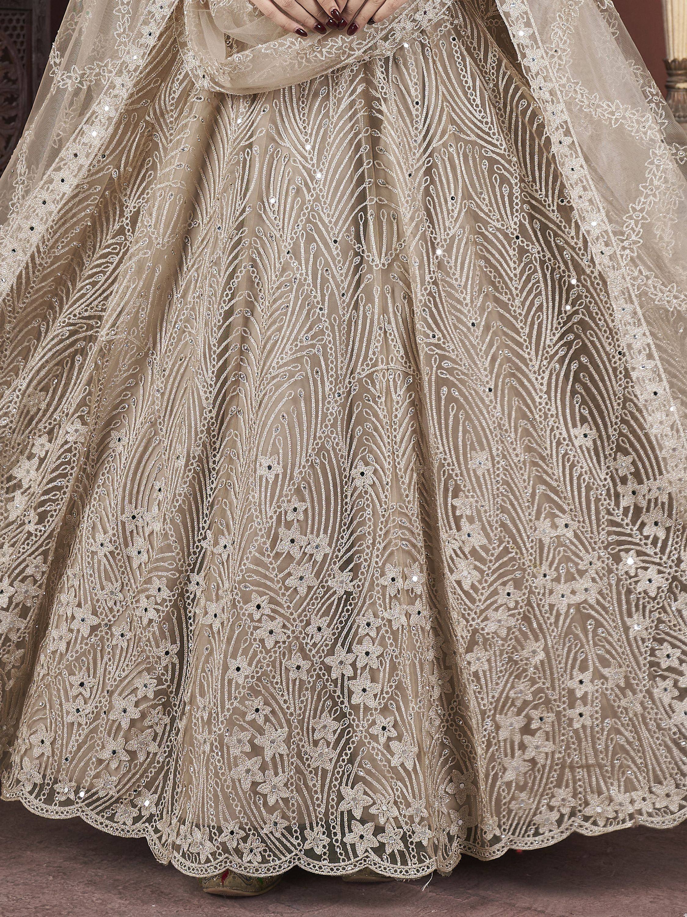 Elegant beige lehenga with intricate floral embroidery and sequin detailing for Indian ethnic wear