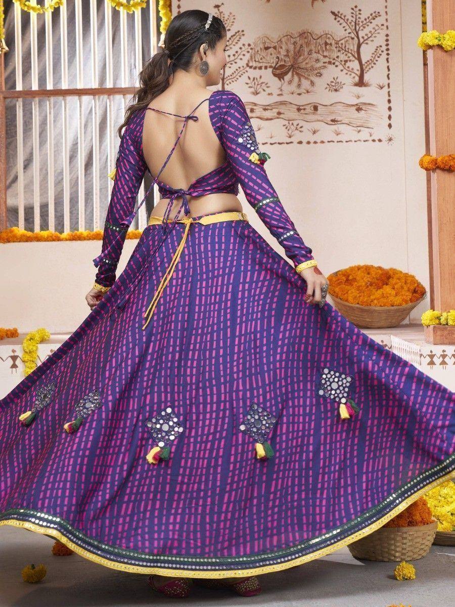 Purple and pink printed lehenga choli with mirror work and tassels, ethnic Indian wear