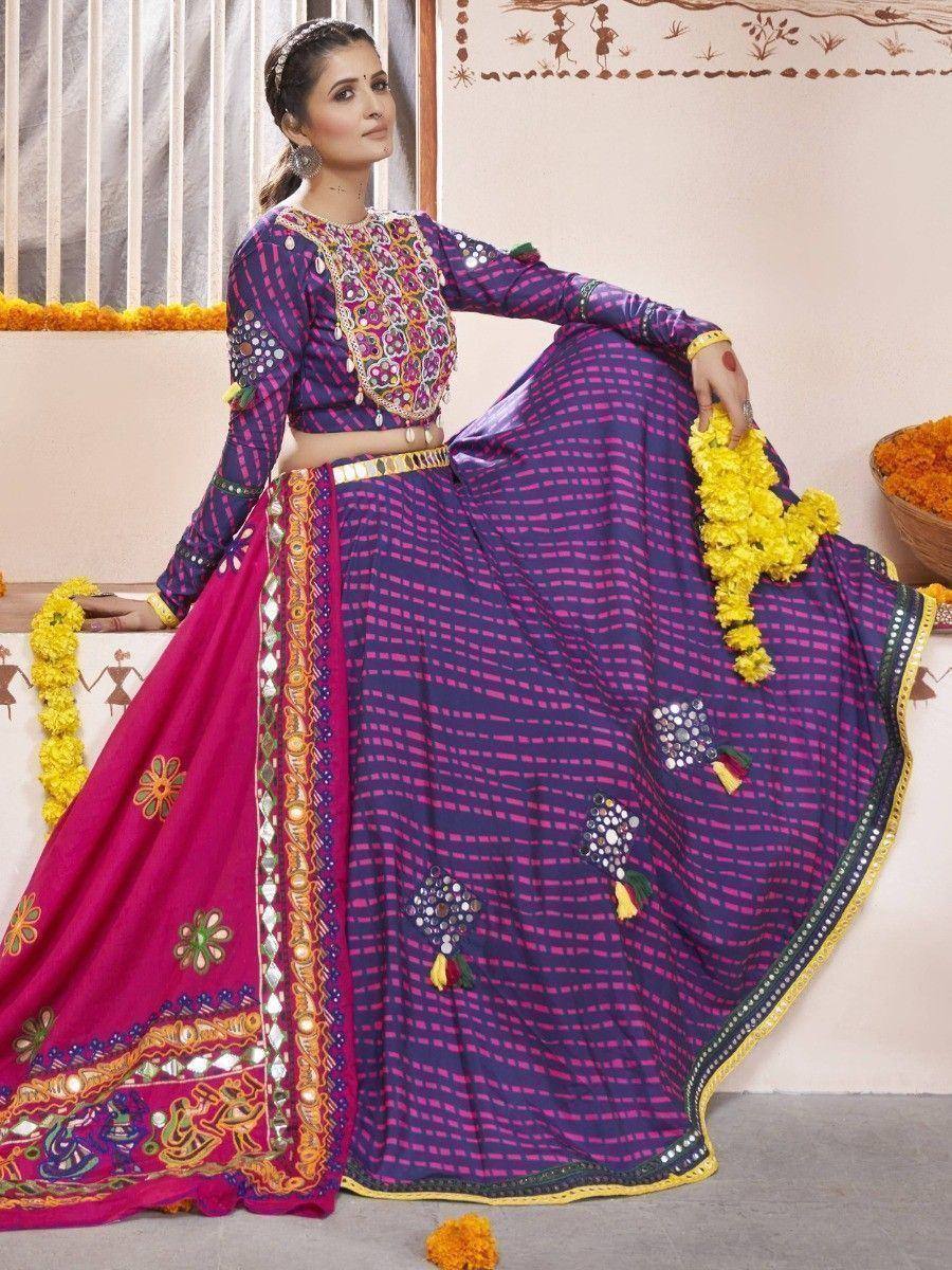 Purple and pink embroidered lehenga choli with mirror work, perfect for Indian ethnic occasions