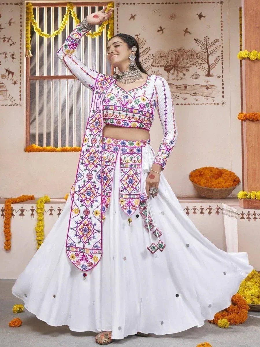 White embroidered lehenga choli with colorful mirror work, perfect for Indian ethnic wear and festive occasions