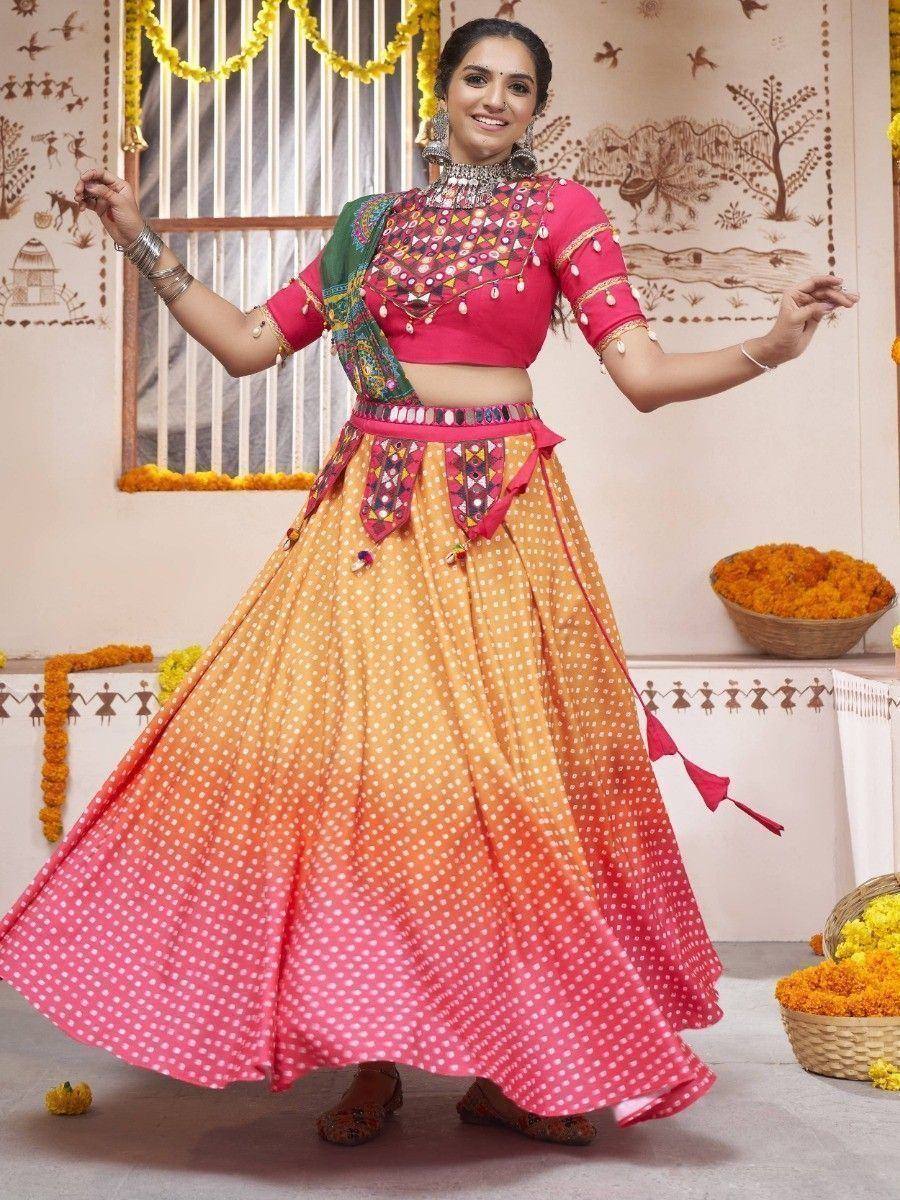 Vibrant pink and orange ombre lehenga choli with mirror work, perfect for Indian ethnic wear occasions