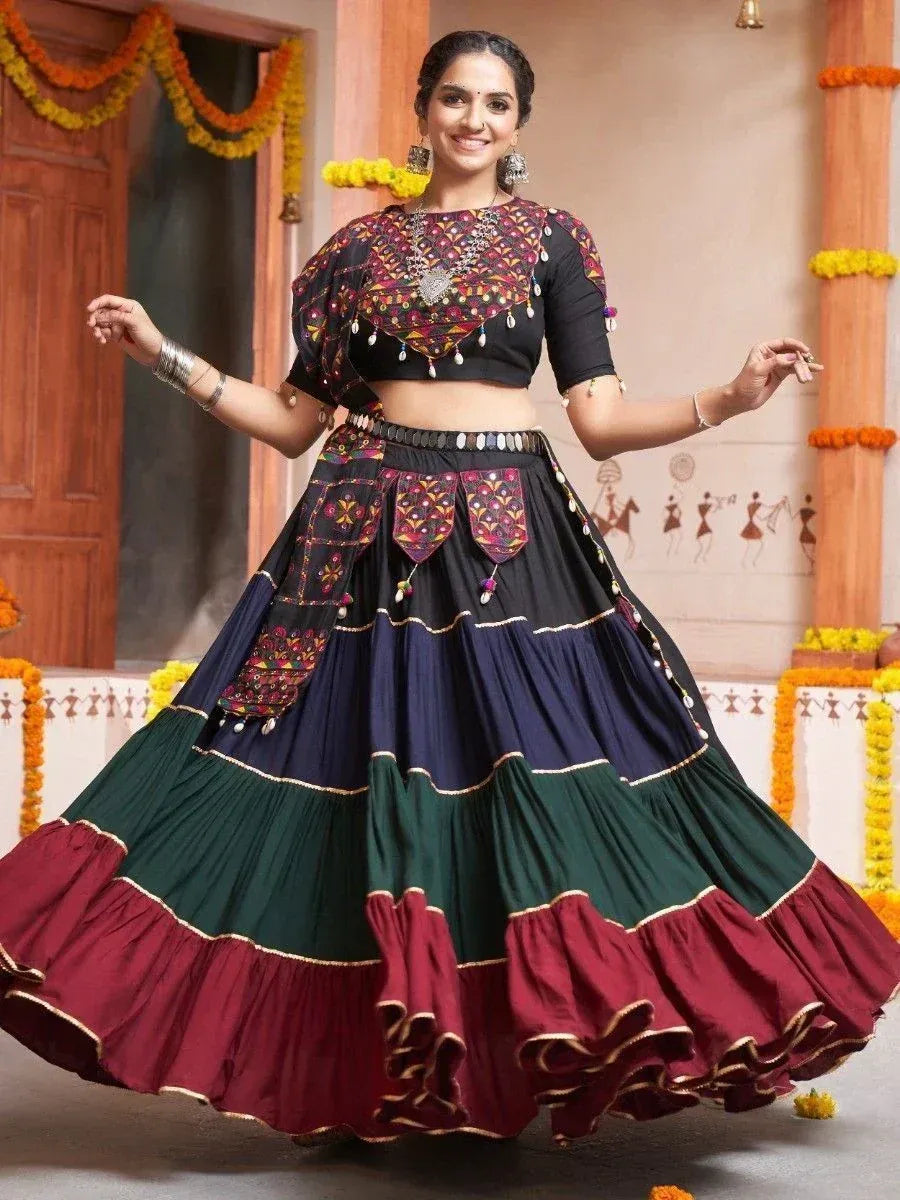Woman in colorful embroidered lehenga choli with layered skirt, perfect for Indian ethnic occasions