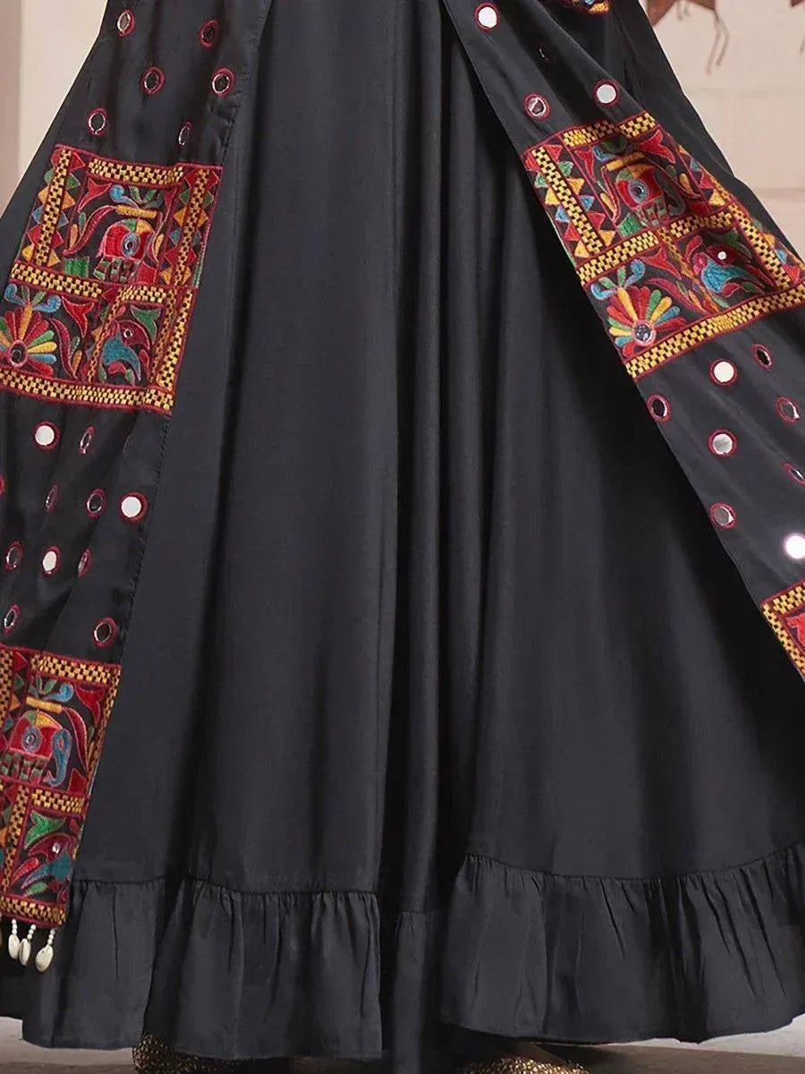 Black ethnic gown with colorful embroidery and mirror work, perfect for Indian festive wear