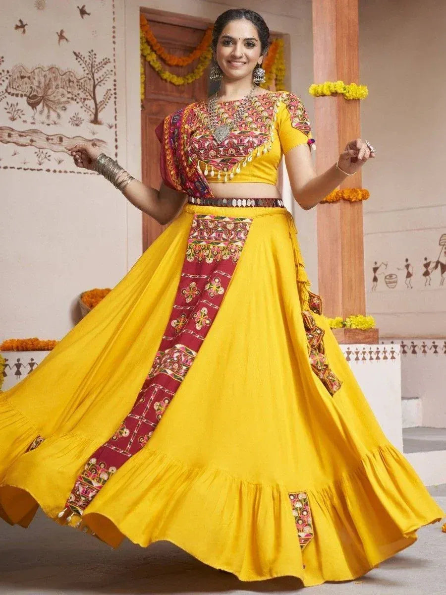 Vibrant yellow lehenga choli with embroidered red panel, perfect for Indian ethnic occasions