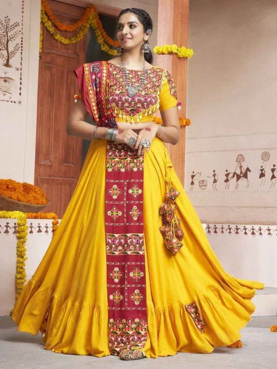 Yellow and maroon embroidered lehenga choli with mirror work, perfect for Indian ethnic occasions