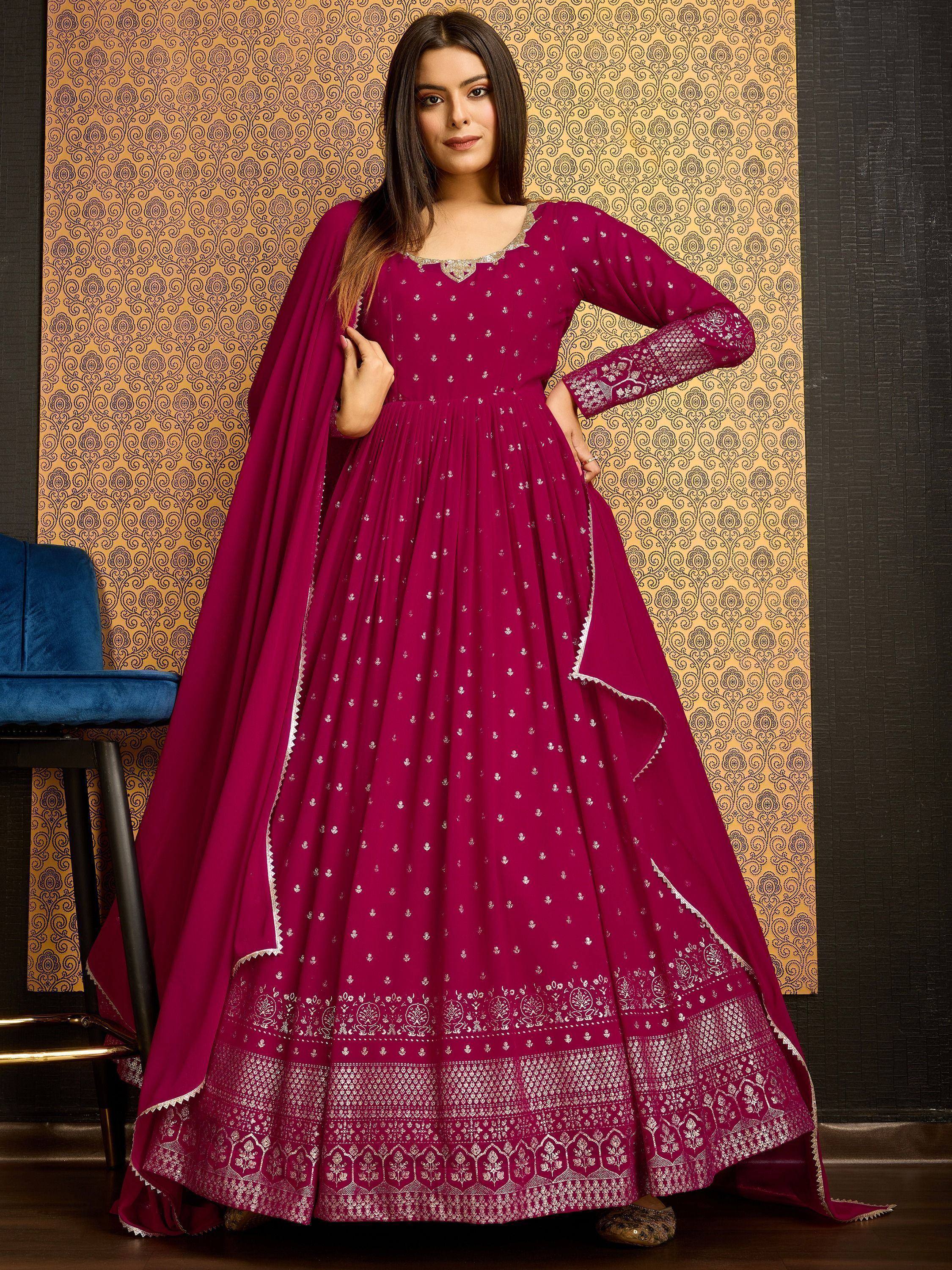 Elegant maroon ethnic gown with silver embroidery, perfect for Indian festive occasions and weddings.