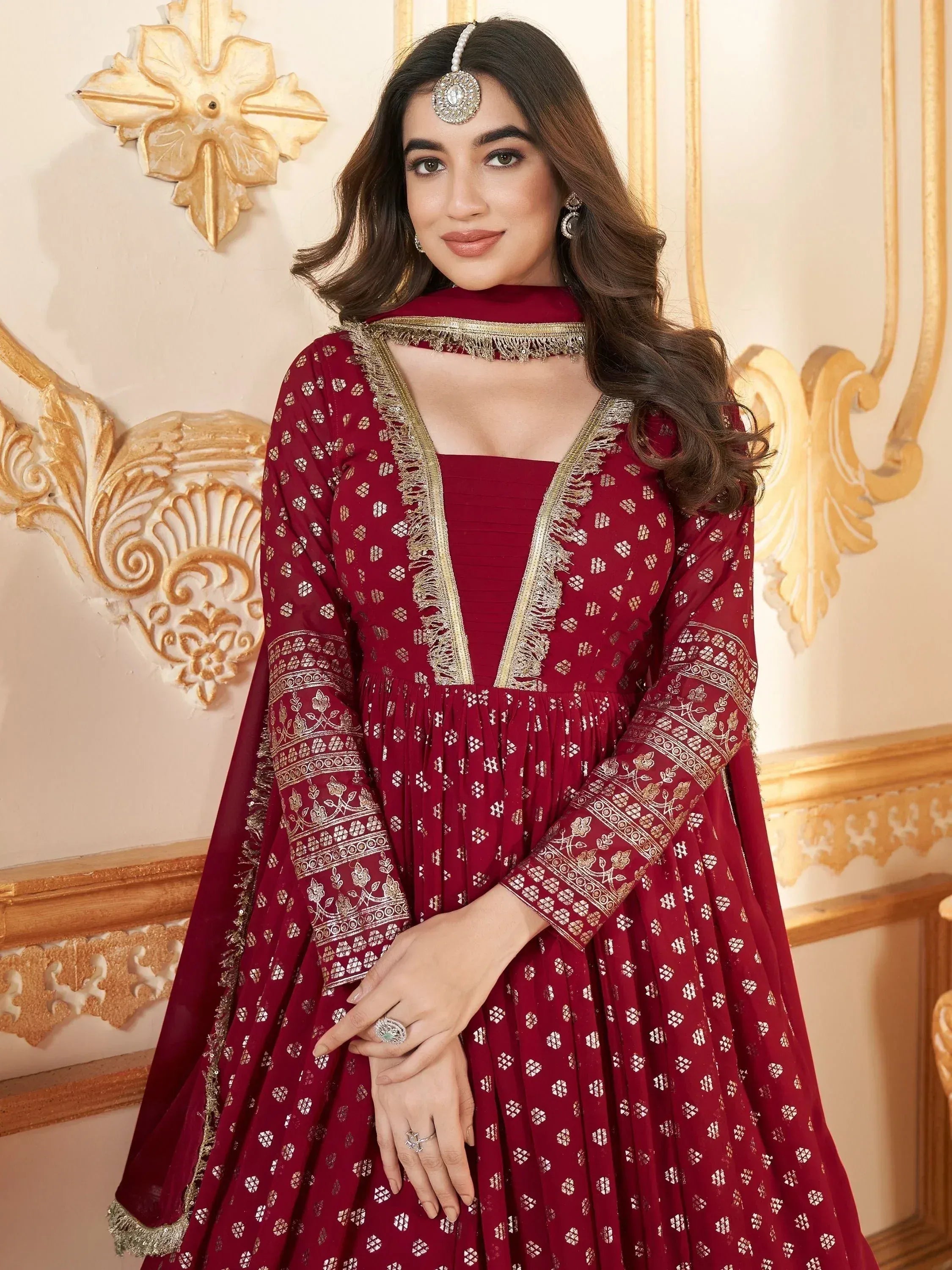 Maroon ethnic anarkali with gold embroidery, perfect for Indian weddings and festive occasions.