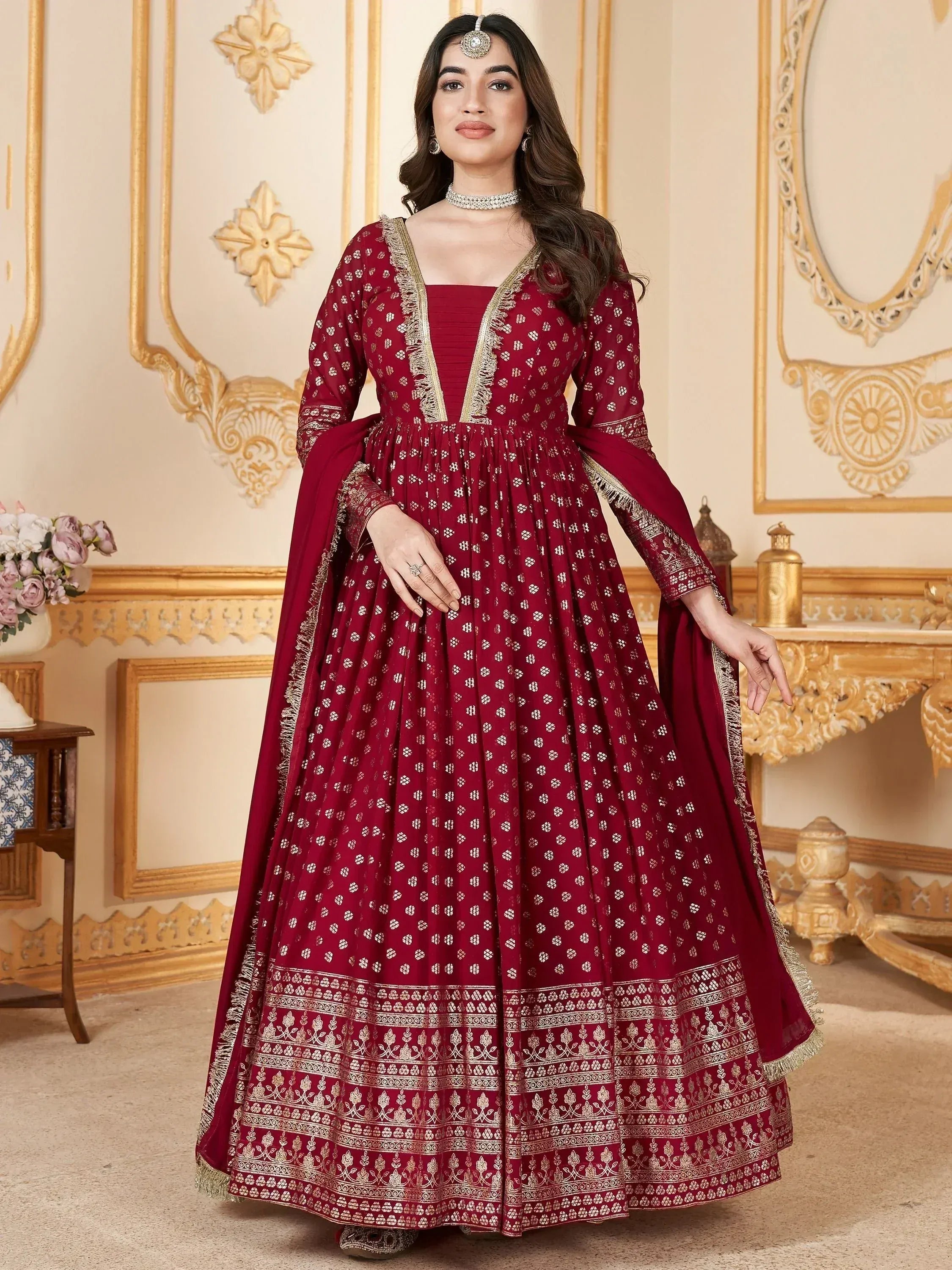 Maroon ethnic anarkali gown with gold embroidery, perfect for Indian weddings and festive occasions