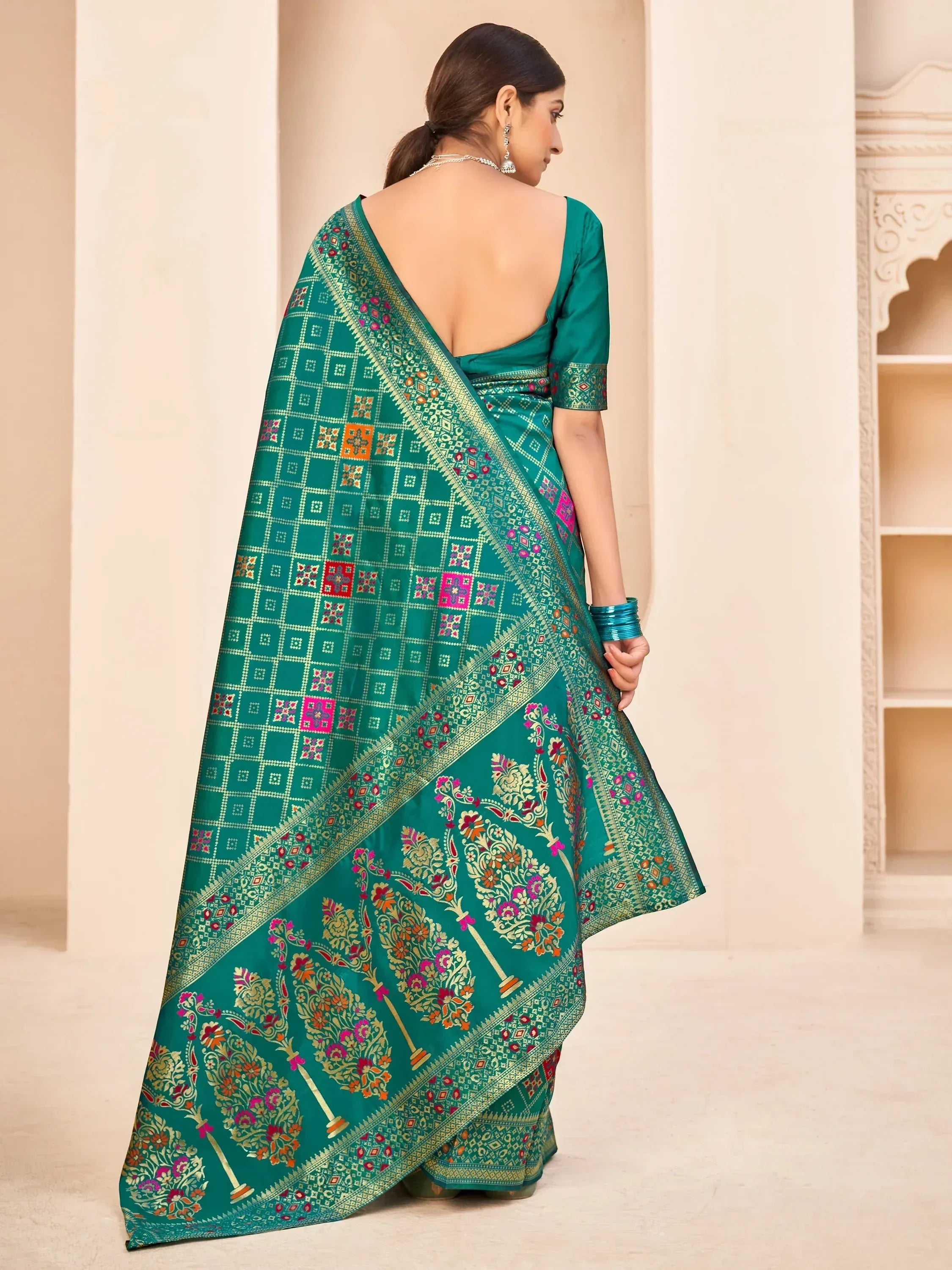 Teal designer saree with floral and geometric print, backless blouse, ethnic wear for women