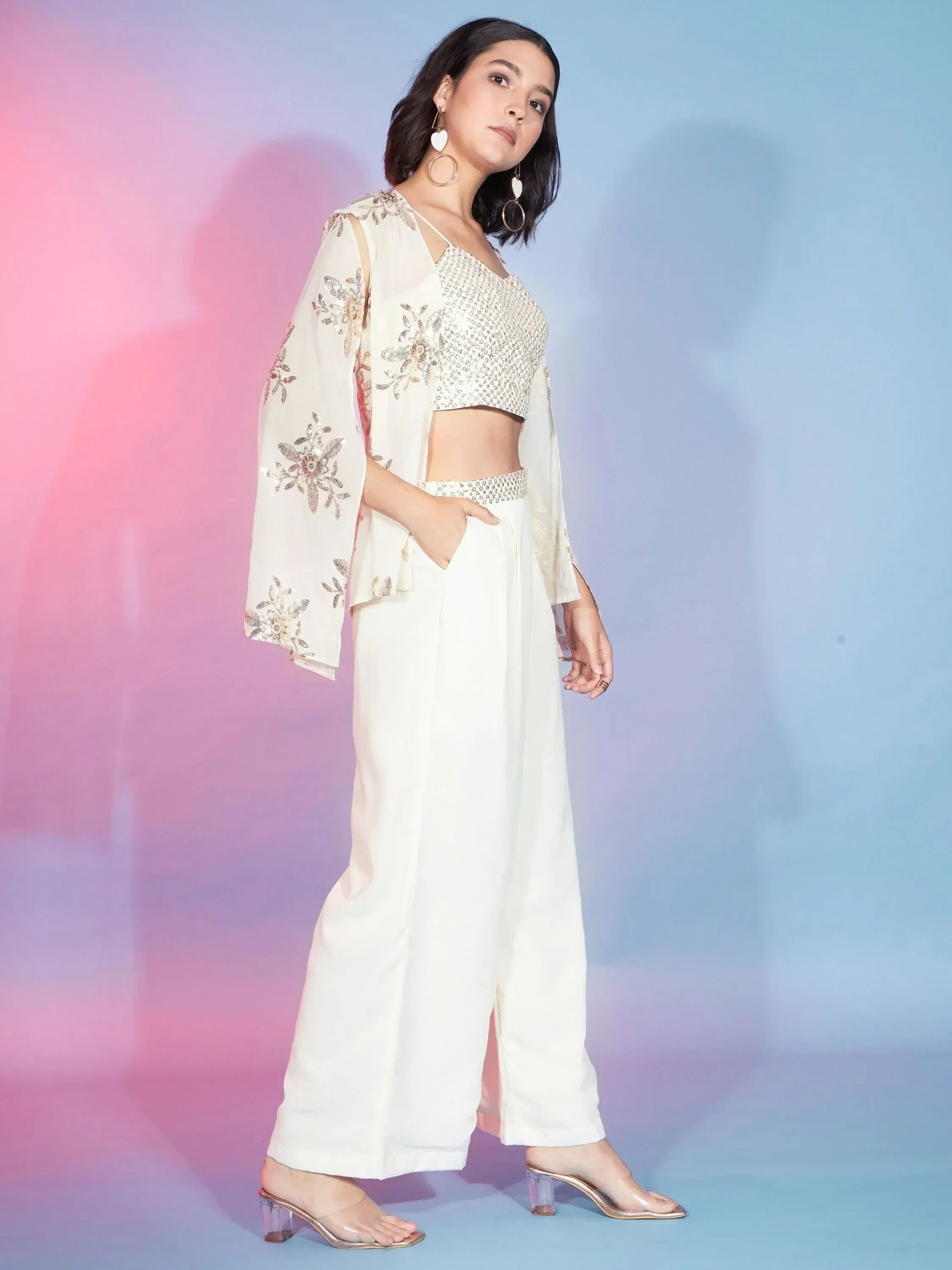 White embroidered ethnic crop top with wide pants and sheer jacket, perfect for Indian festive wear