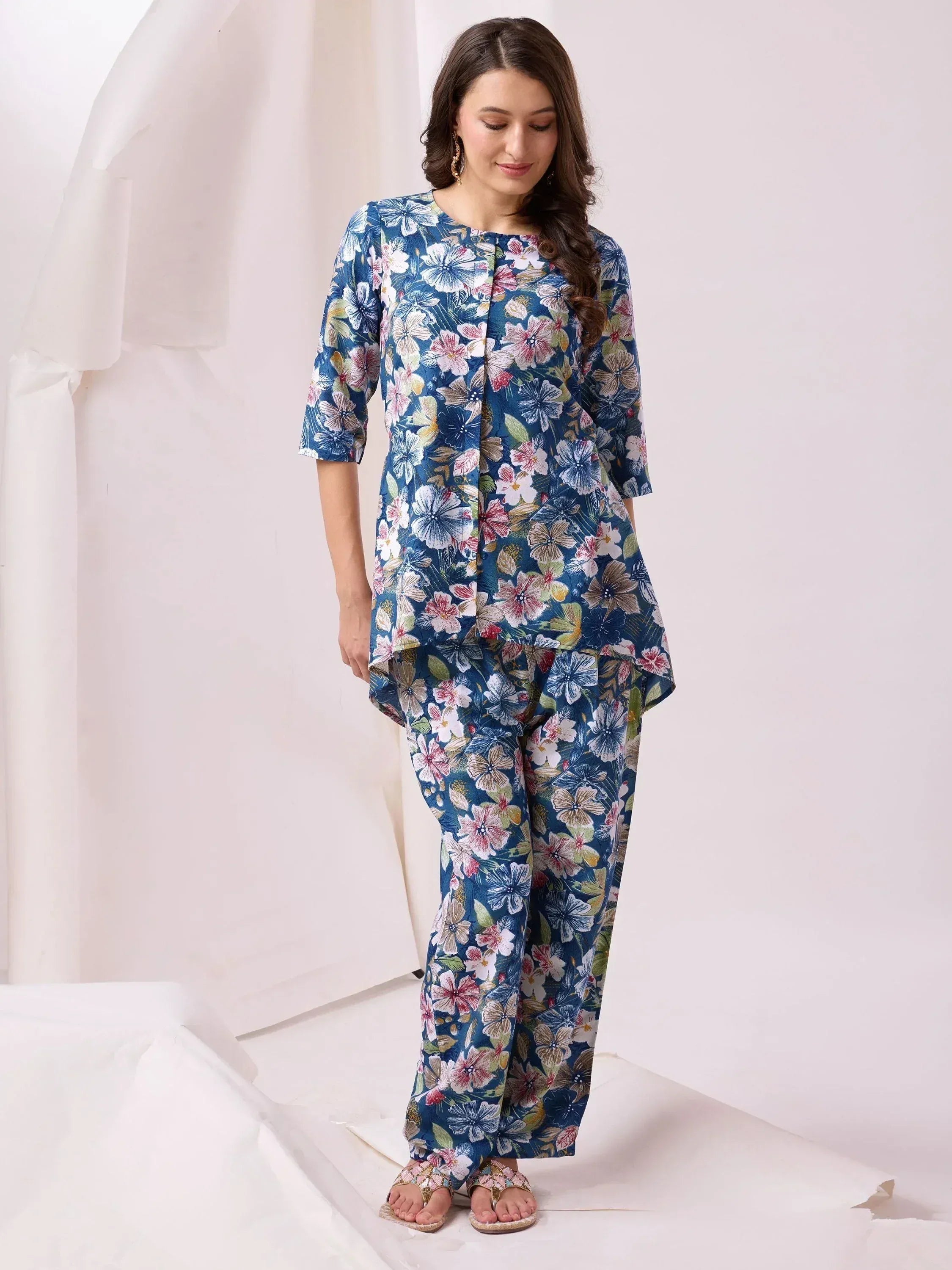 Floral print ethnic salwar kameez with blue base, perfect for casual wear or festive occasions.