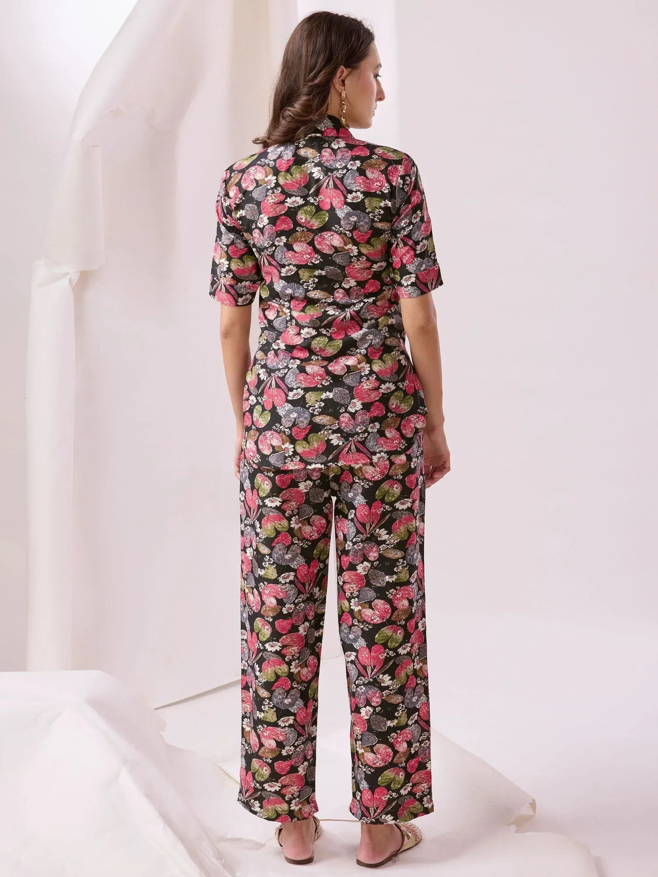 Floral print ethnic jumpsuit with short sleeves and wide legs, perfect for modern Indian wear.
