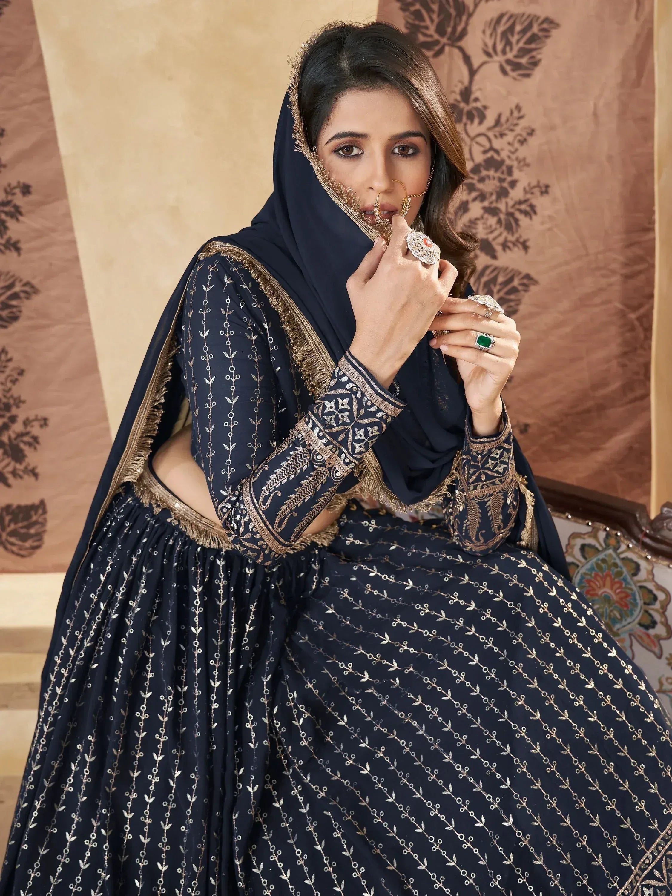 Navy blue designer lehenga choli with gold embroidery, perfect for Indian ethnic wear and festive occasions.