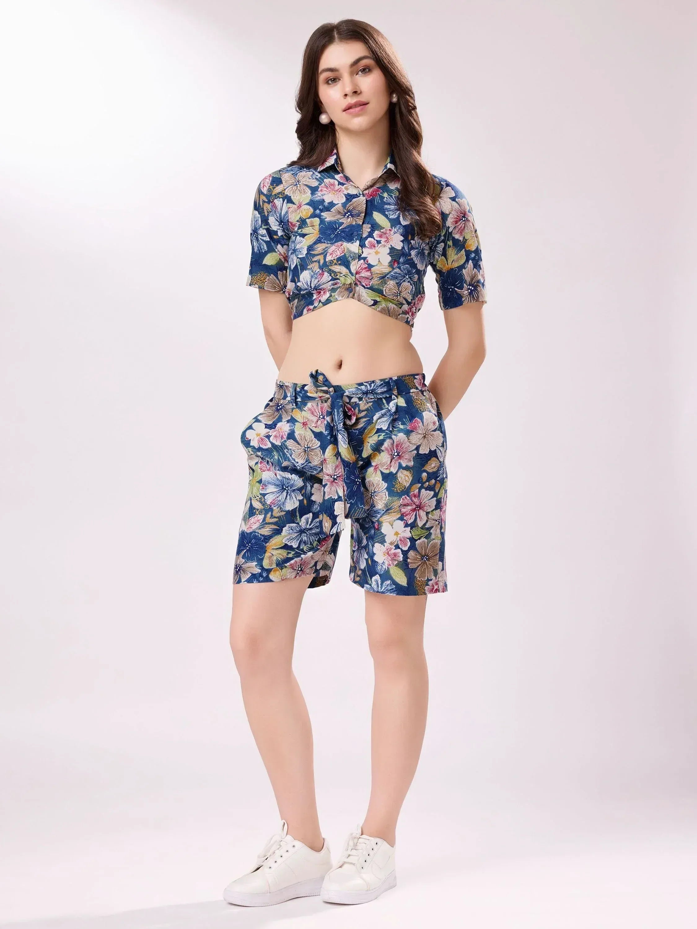 Floral print crop top and shorts set with tie waist, paired with white sneakers for casual ethnic wear