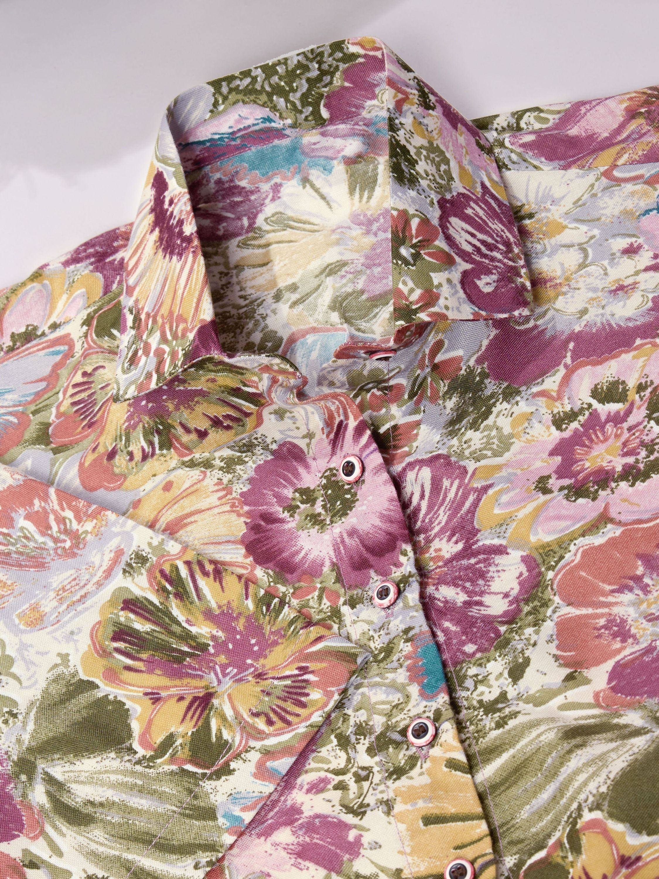 Floral printed ethnic kurta with vibrant purple, green, and yellow blooms, perfect for Indian wear.
